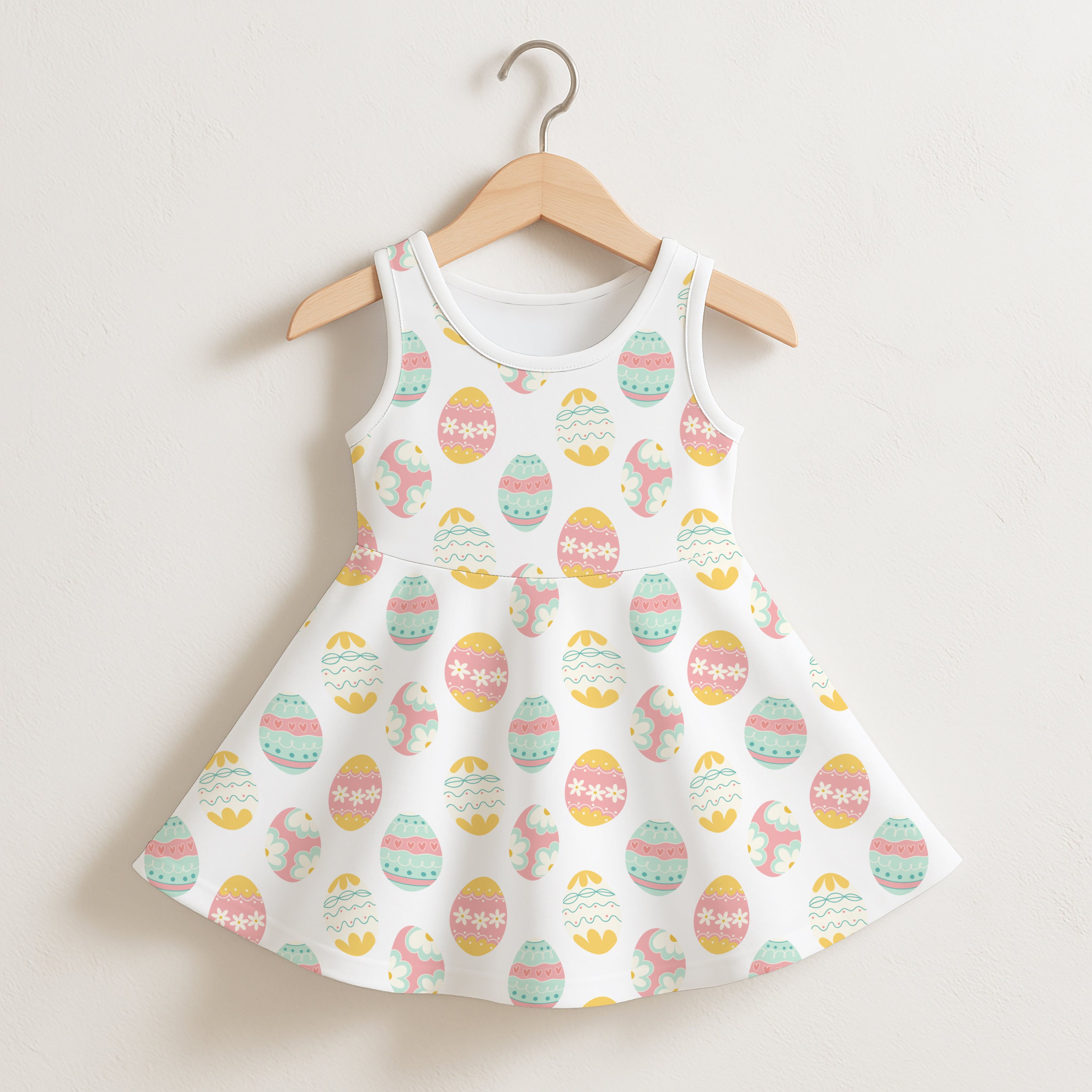 Girls patterned Easter eggs sleeveless dress white cotton with flared skirt and pastel yellow pink mint green eggs design