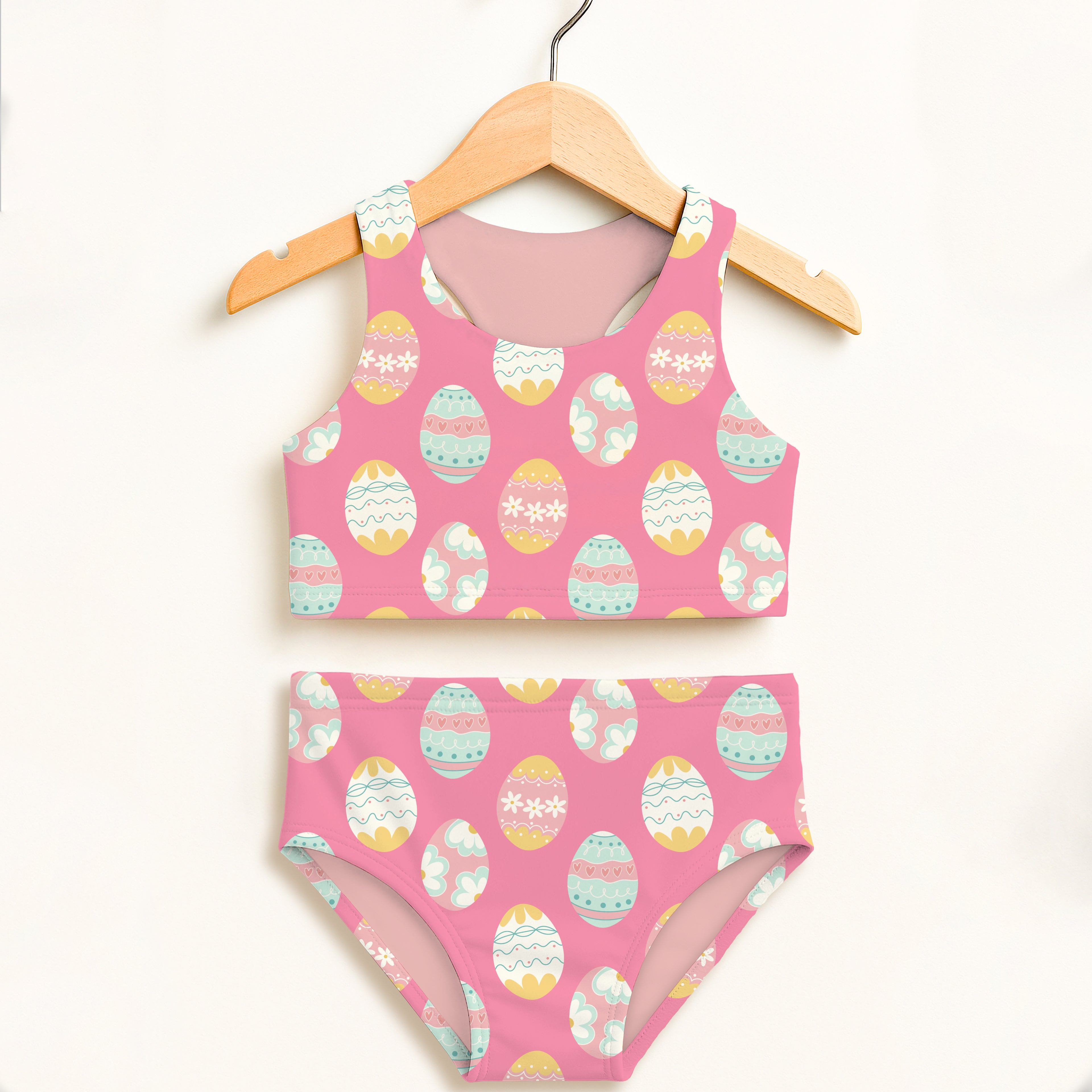 Girls pink two piece swimsuit with colorful pastel easter egg pattern double layered upf 50 high waisted comfort