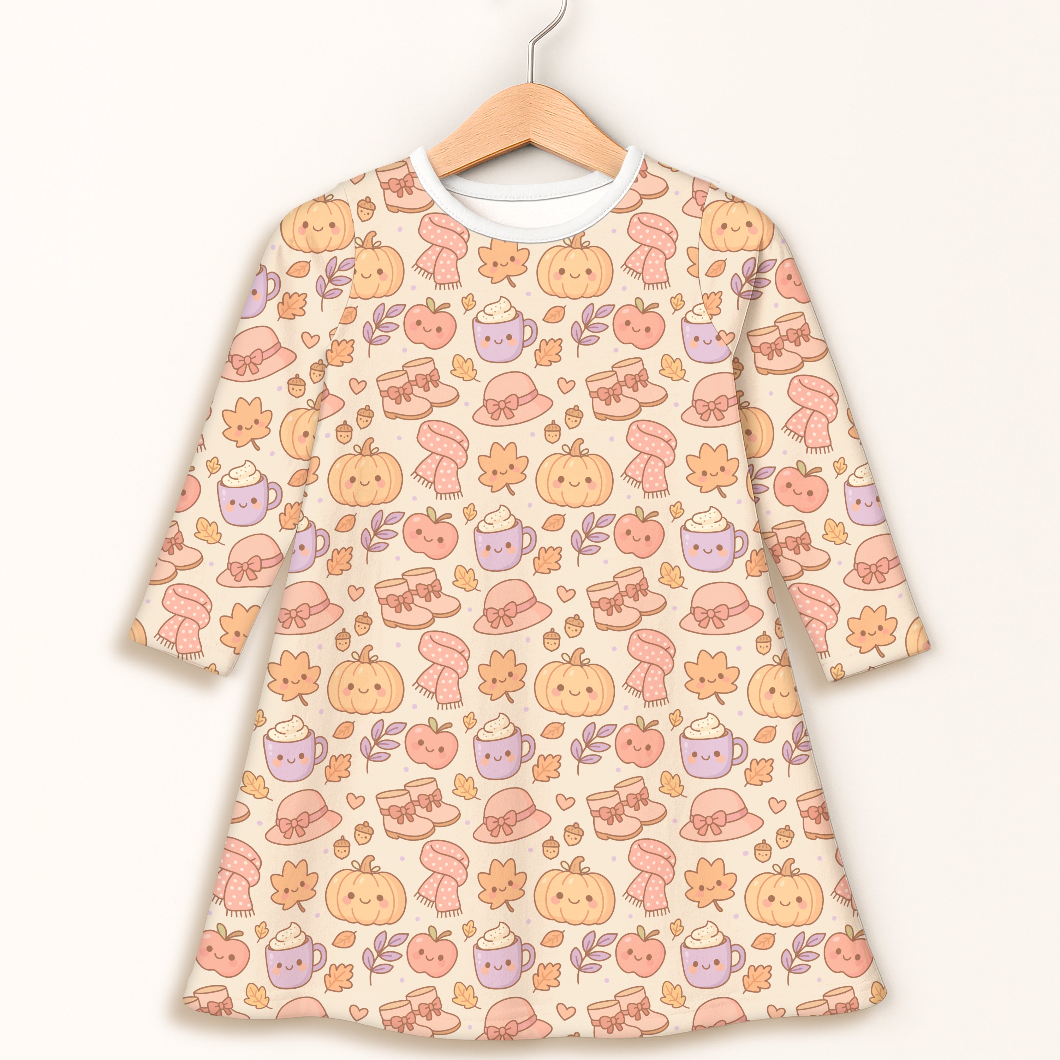 Girls fall pumpkin long sleeve dress in soft cream with kawaii smiling pumpkins cozy hats and steaming mugs pattern