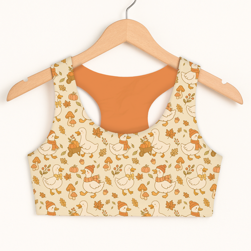 Beige girls fall ducks sports bra with quick drying fabric and playful autumn ducks pumpkins and leaves pattern