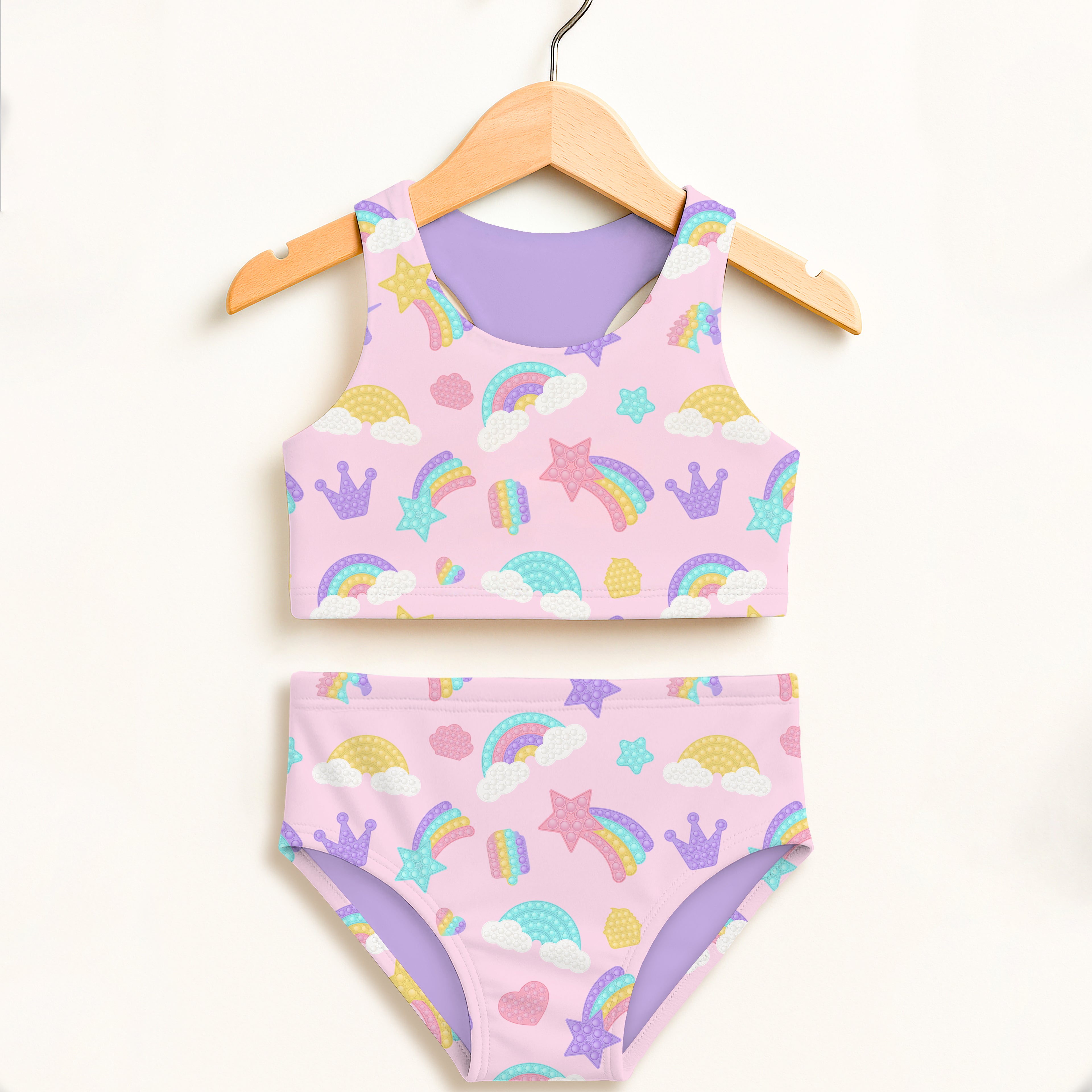 Pink and purple girls rainbow fidget pop themed two piece swimsuit with rainbows stars crowns clouds and hearts pattern