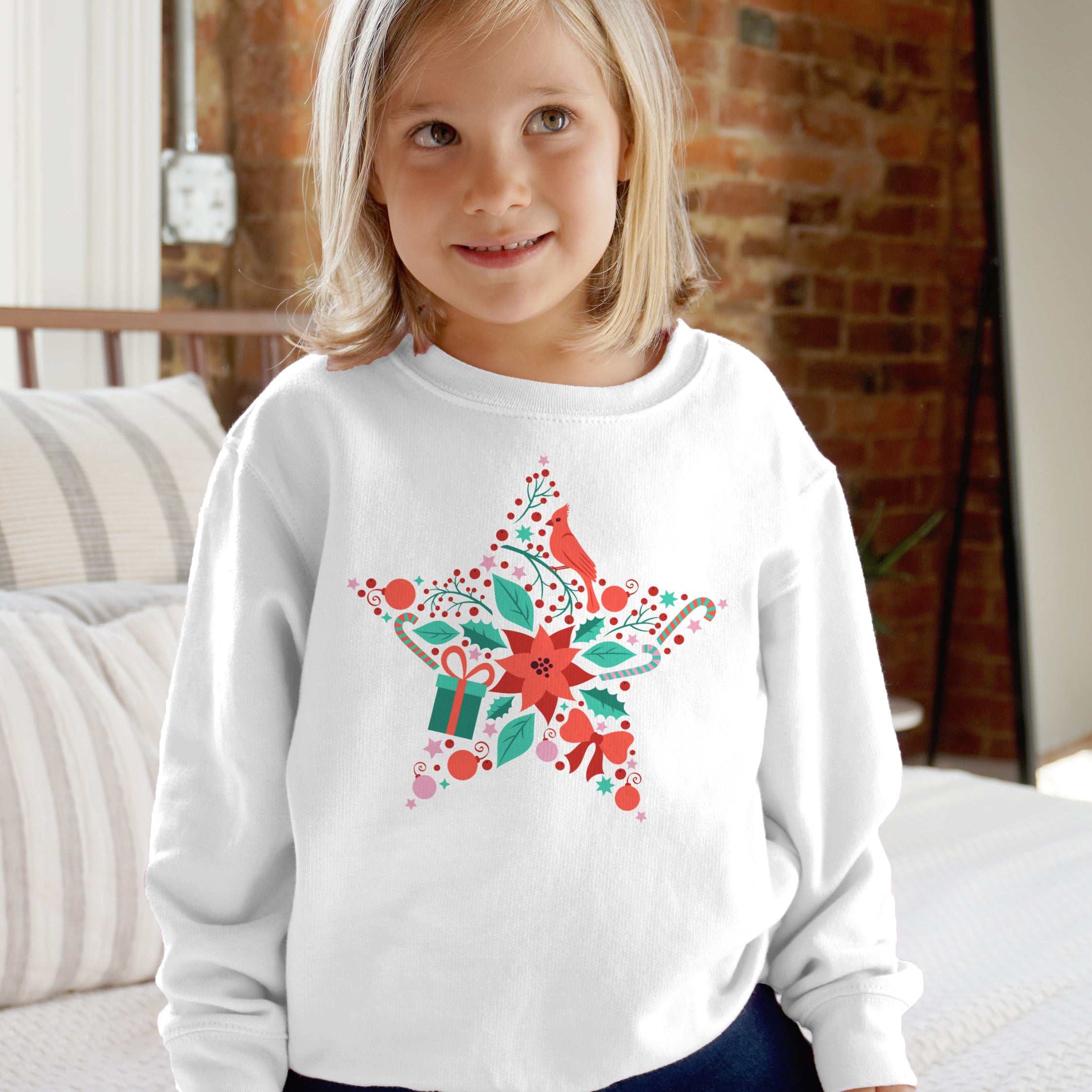 White long-sleeved sweatshirt with festive red and green star decorated with cardinal poinsettia candy canes and bows