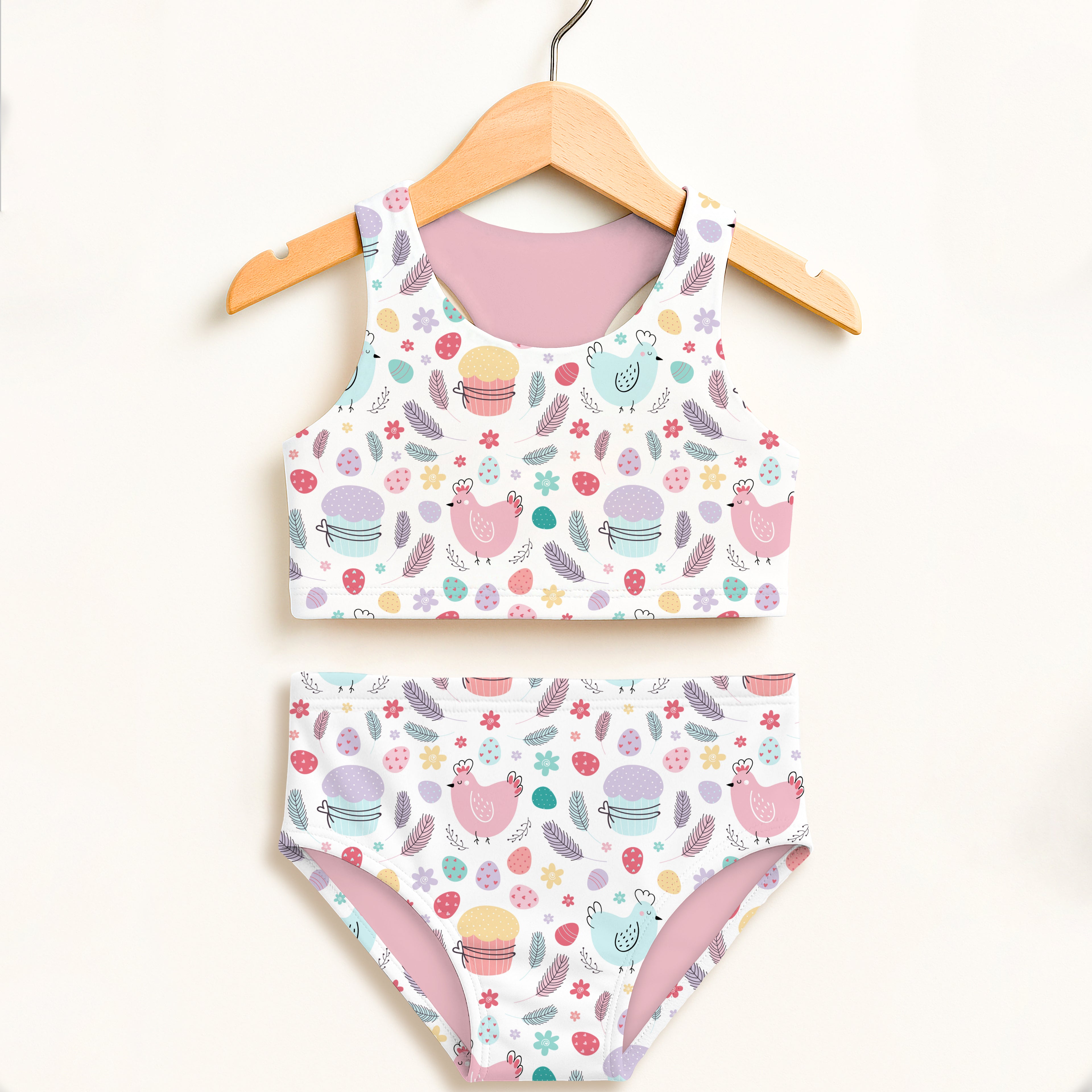 Girls pastel easter birds two piece swimsuit with white top and matching bottoms featuring chicks and cupcakes design