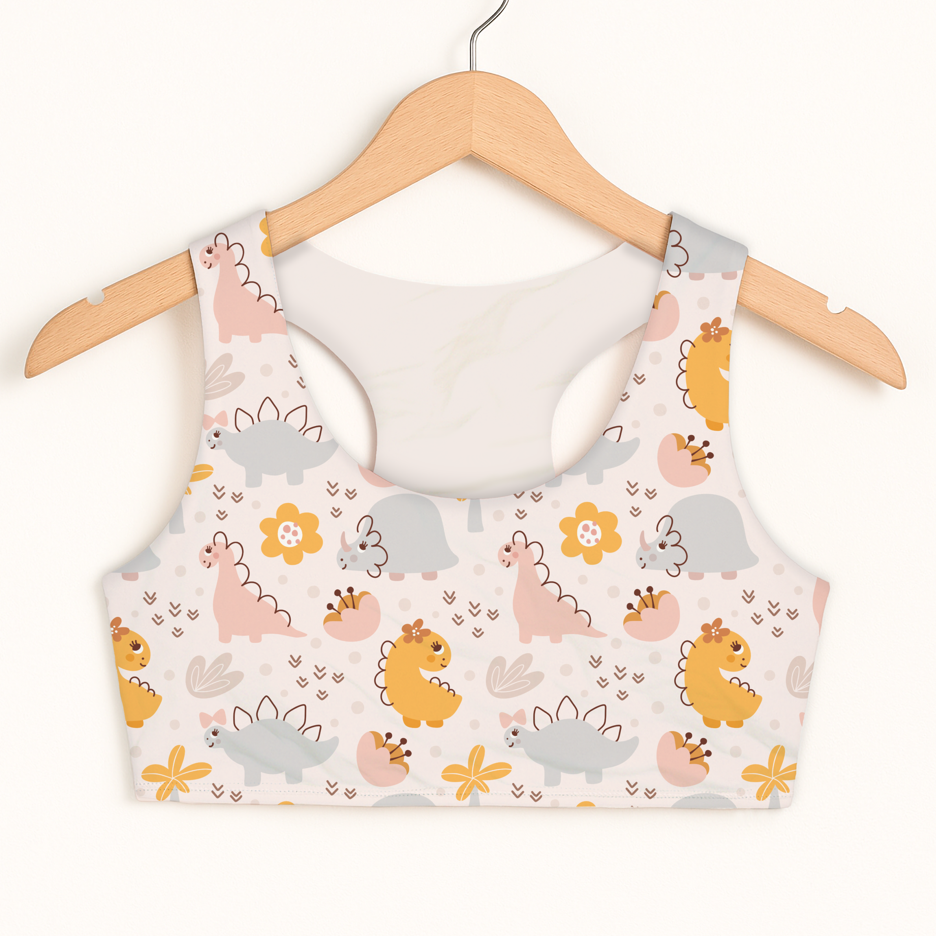 Girls floral dinosaur sports bra in white with pastel cartoon dinosaurs and flowers quick drying double layered comfort