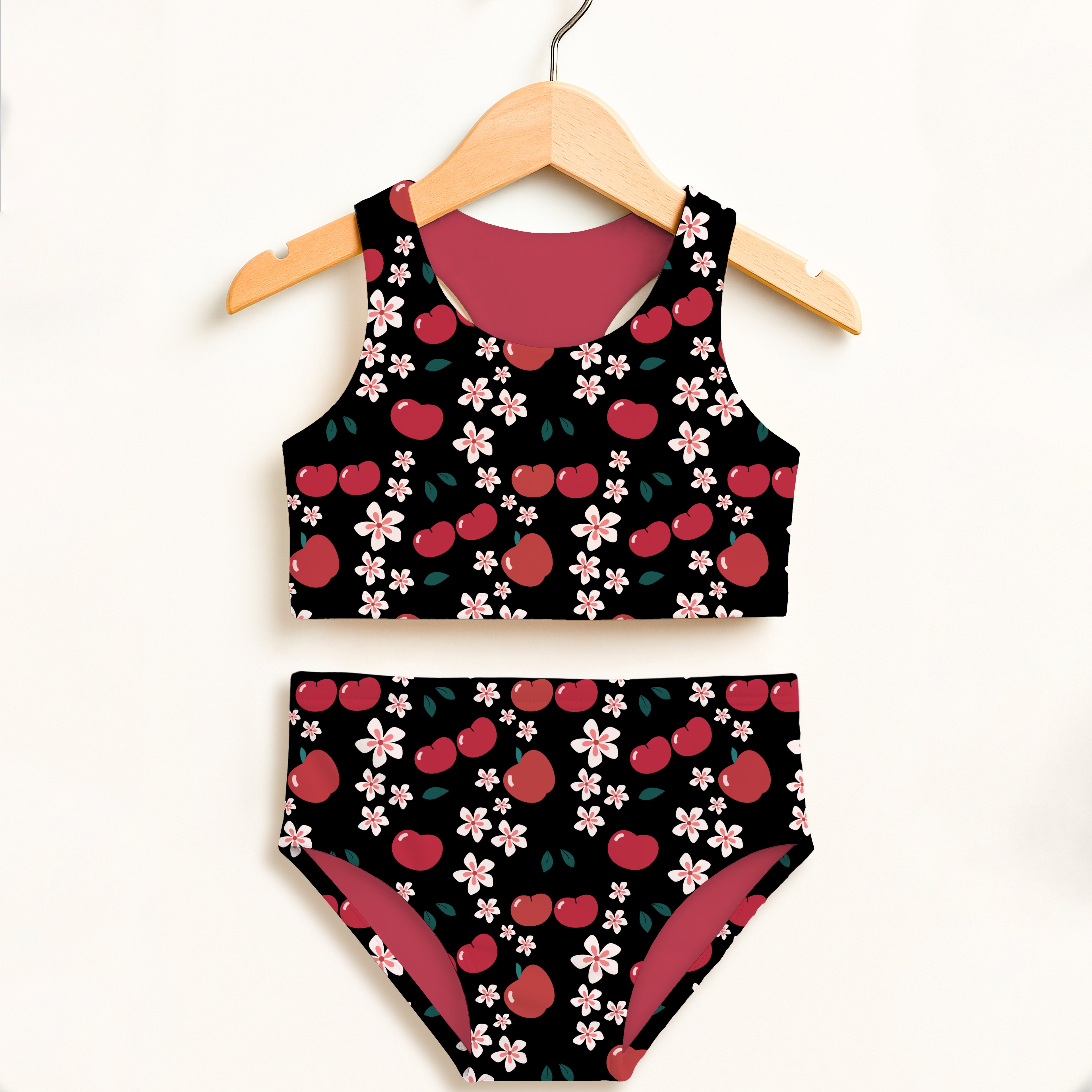 Girls black cherry blossom two piece swimsuit with pink flower pattern and magenta lining upf 50 plus high waisted comfort