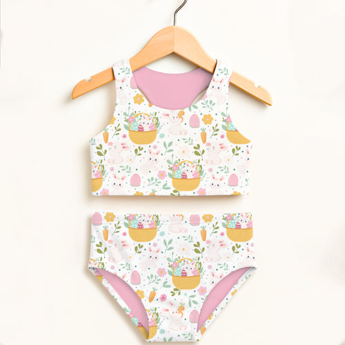 Girls easter basket bunny two piece swimsuit with pastel yellow baskets colorful eggs pink bunnies white base and pink lining