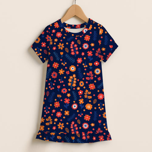 A navy blue girls floral print short sleeve dress with vibrant red orange yellow flowers and ruffle hem