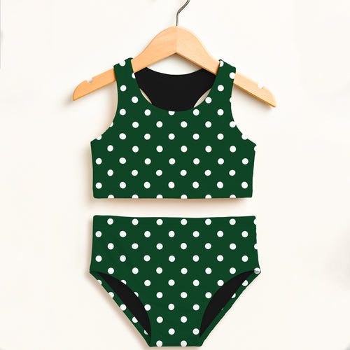 Girls dark green polka dot two piece swimsuit with black lining and double layered upf 50 plus high waisted comfort