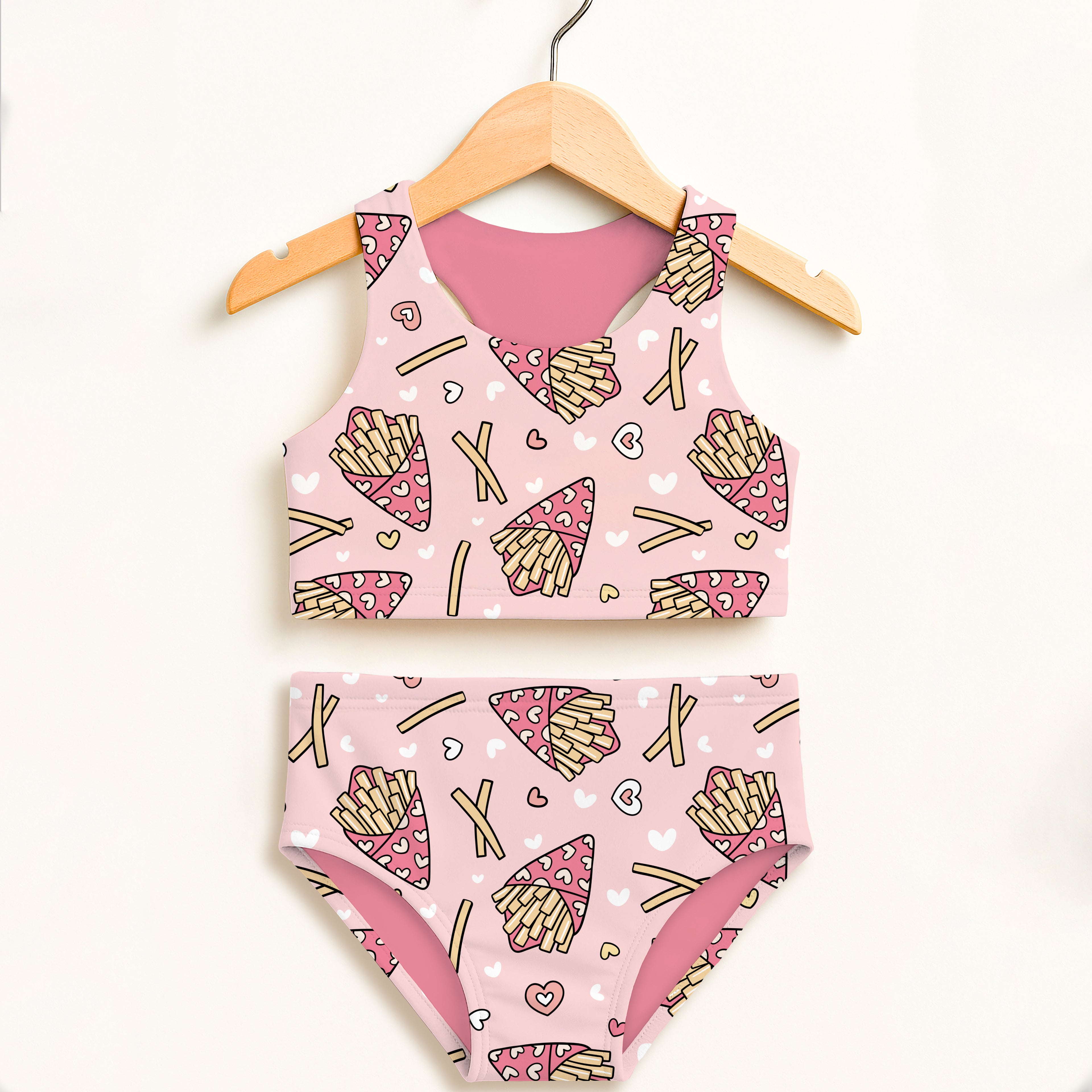 Girls pink french fries two piece swimsuit with playful fries and hearts pattern on light pink double layered fabric
