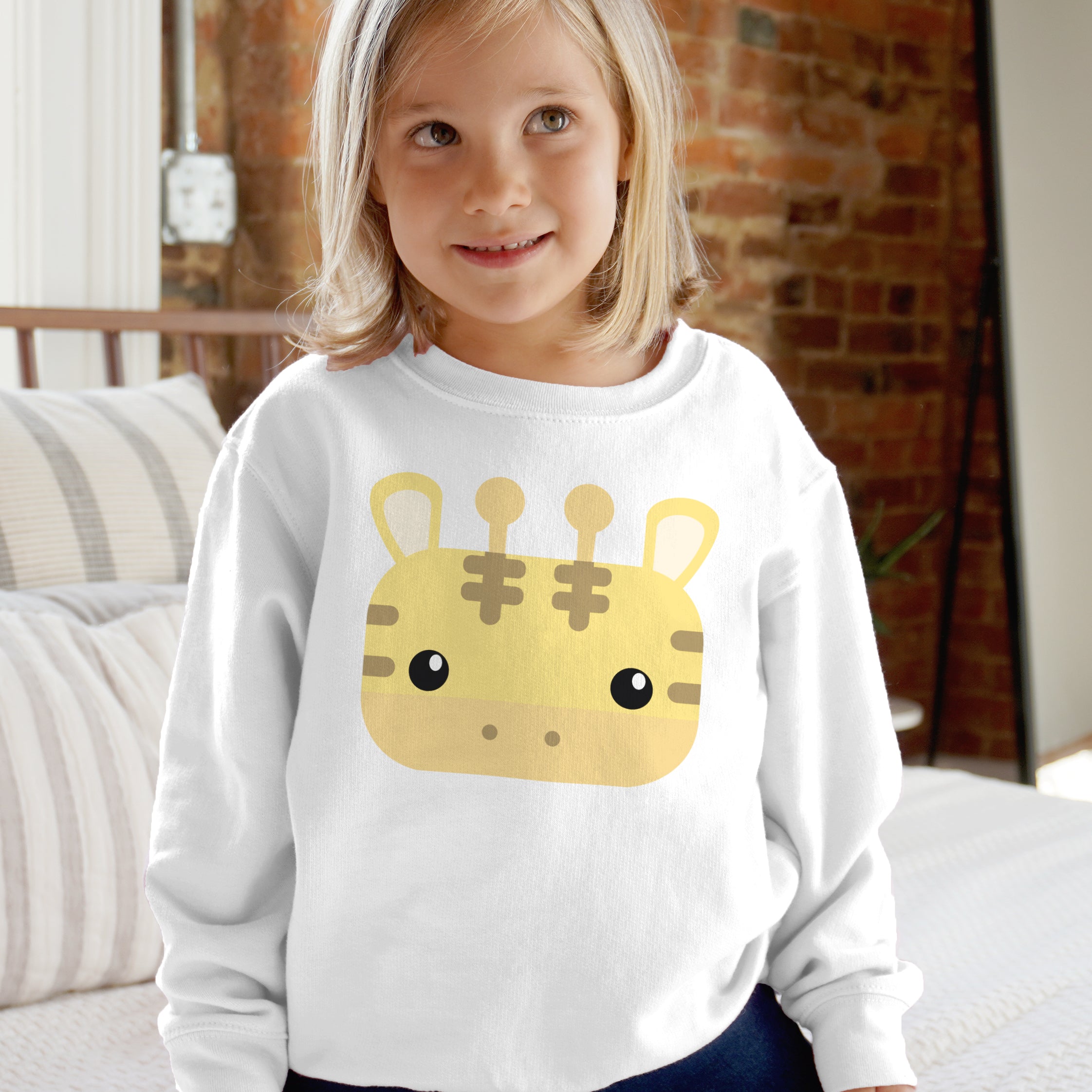White long-sleeved kids sweatshirt with a yellow cartoon giraffe face graphic cute safari animal pullover for boys and girls