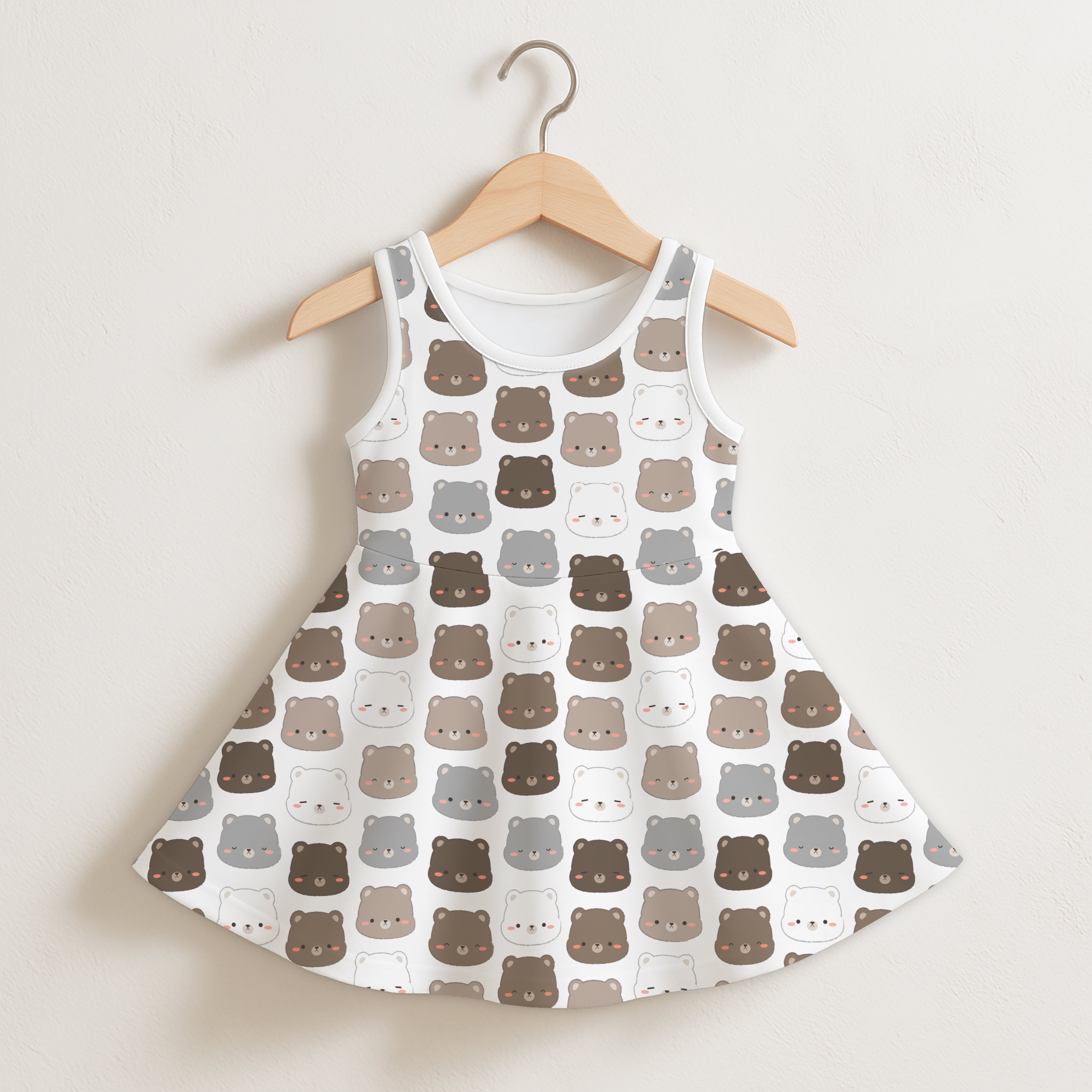 Girls kawaii bear sleeveless dress in white with a flared skirt and brown and gray cartoon bear face pattern