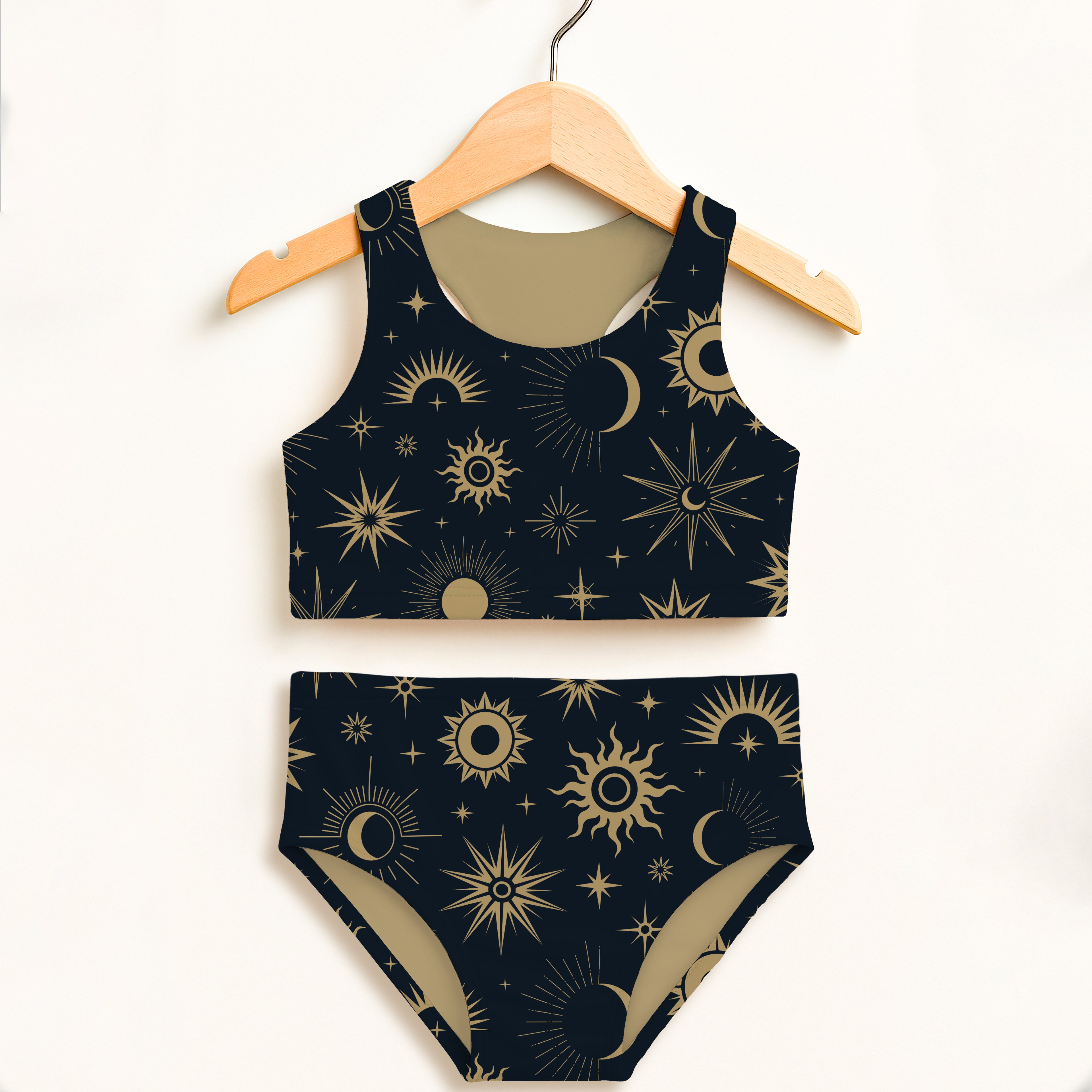 Dark blue girls celestial sun and moon two piece swimsuit set with gold celestial pattern and upf 50 plus protection