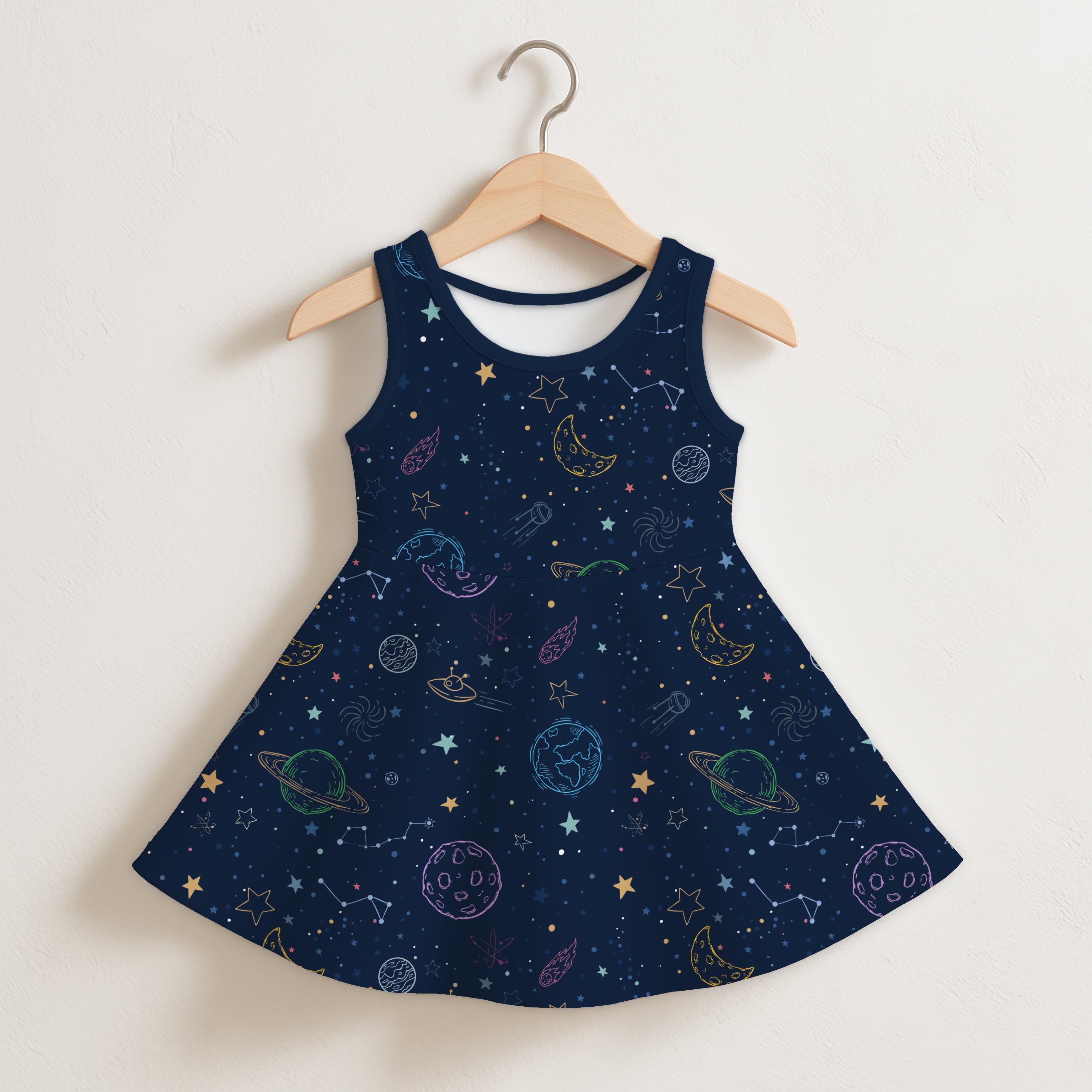 Navy blue sleeveless girls dress with flared skirt featuring colorful rainbow celestial planets stars and constellations design