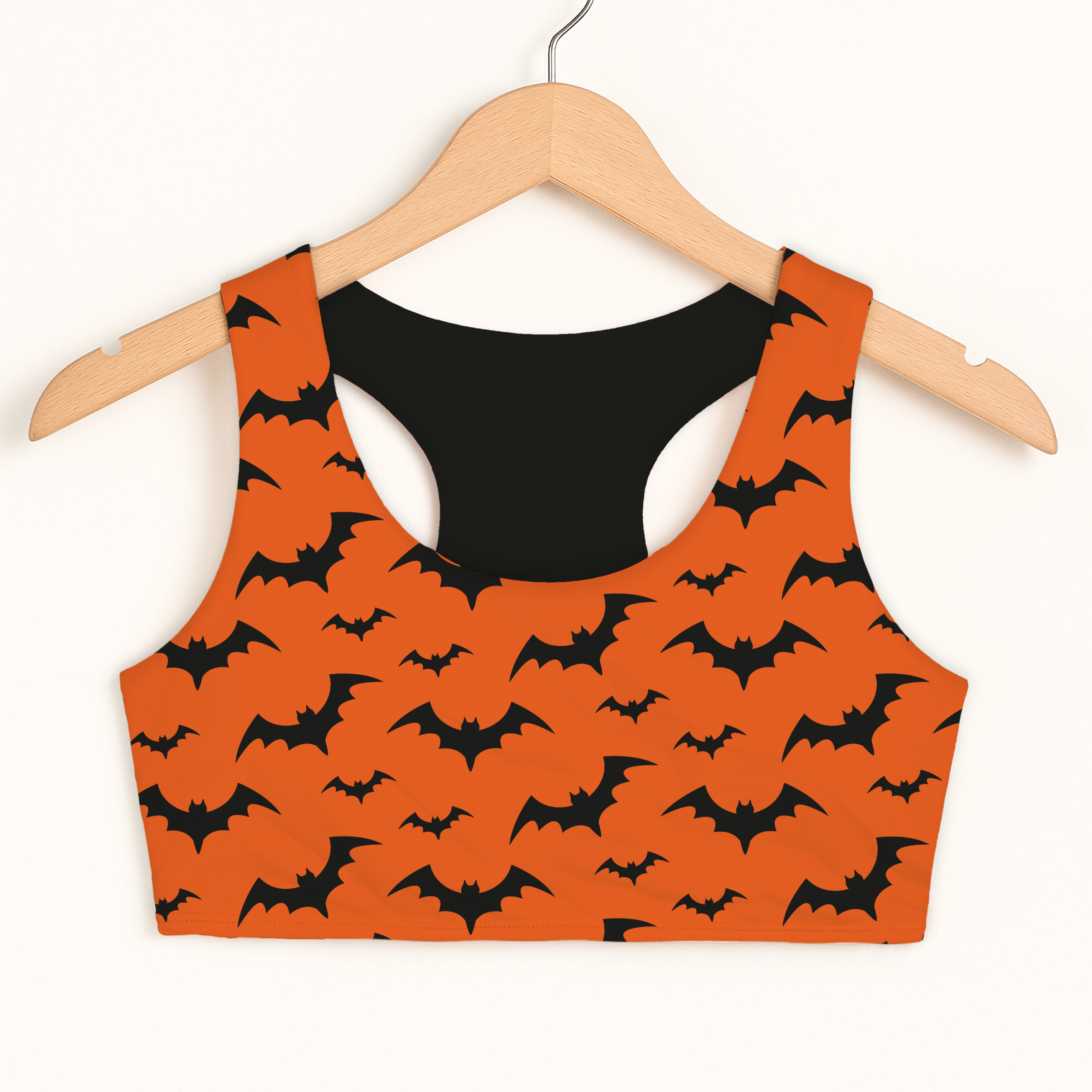 Girls orange bats Halloween sports bra with black bat pattern double layered quick drying comfort and black lining