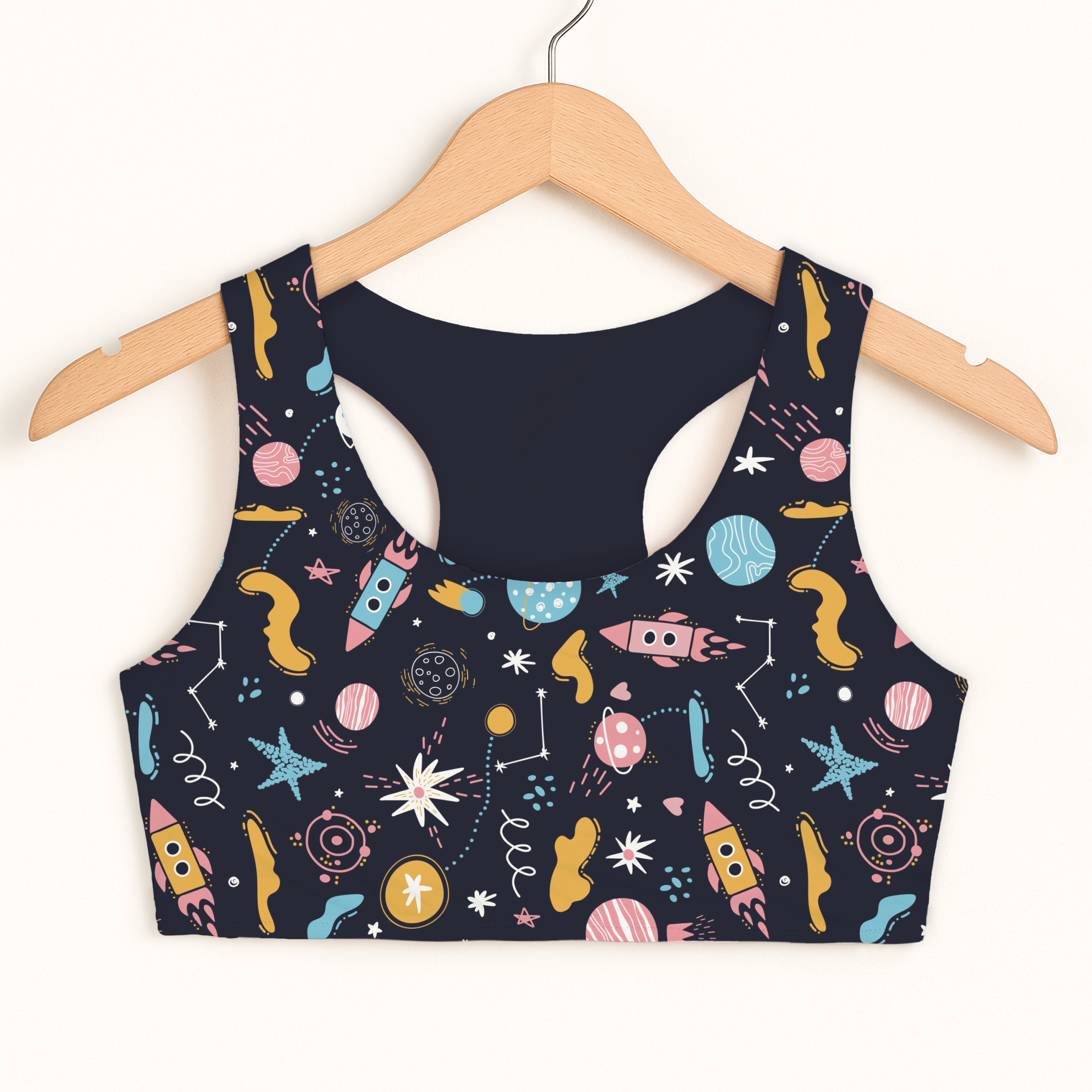 Girls outer space sports bra in navy blue with rocket and planet print quick drying double layered comfort