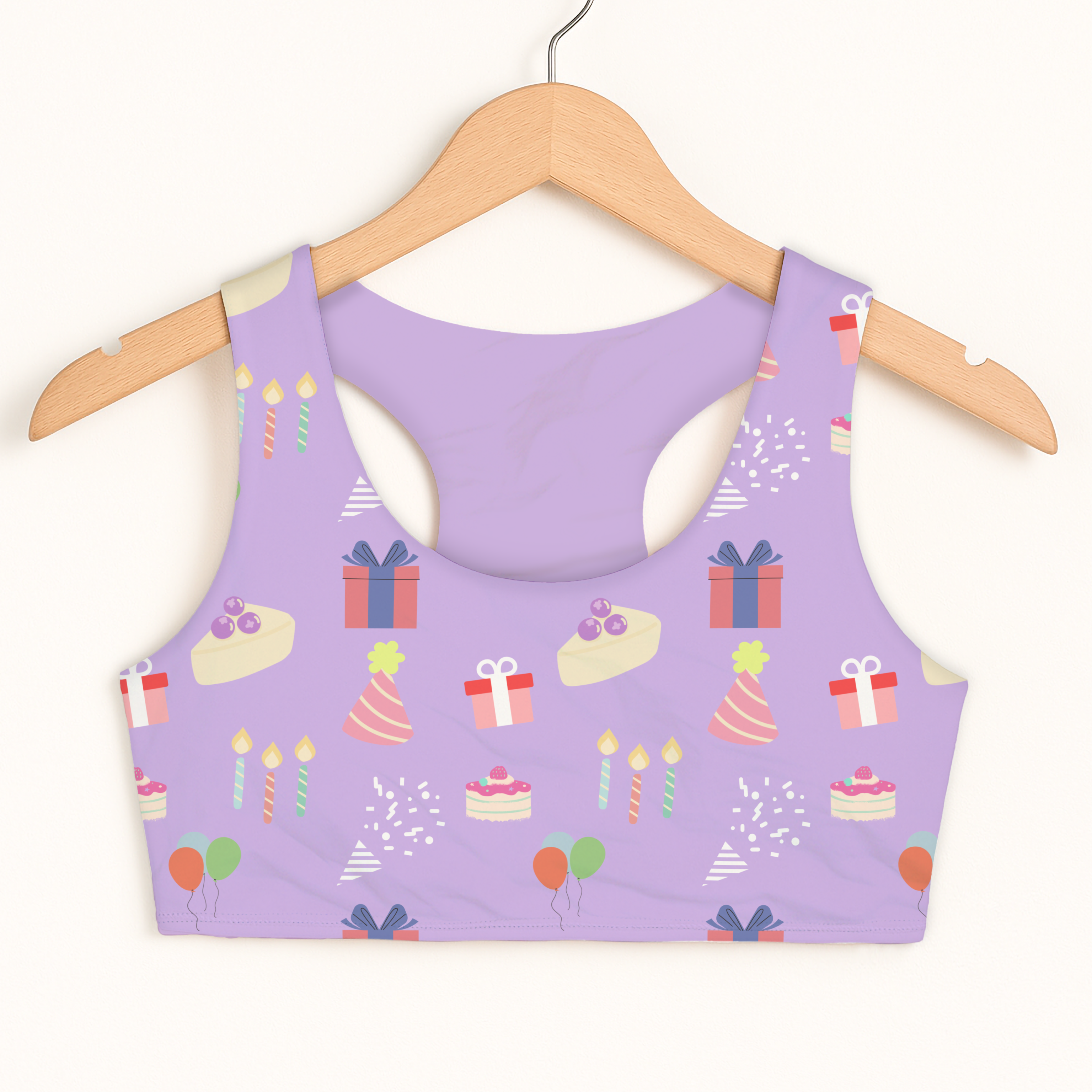 Girls purple birthday pattern sports bra with quick drying double layered comfort featuring cakes gifts and balloons design