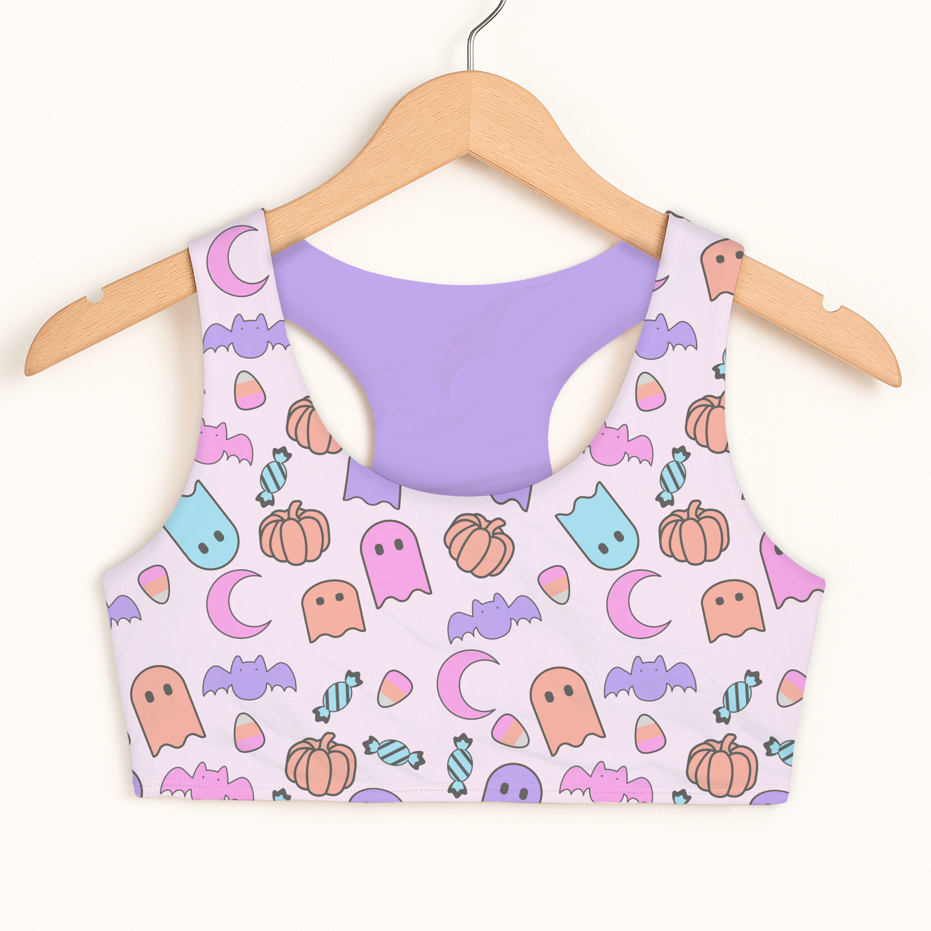 Girls halloween themed quick drying double layered sports bra in pastel with cute ghosts bats pumpkins and candy print