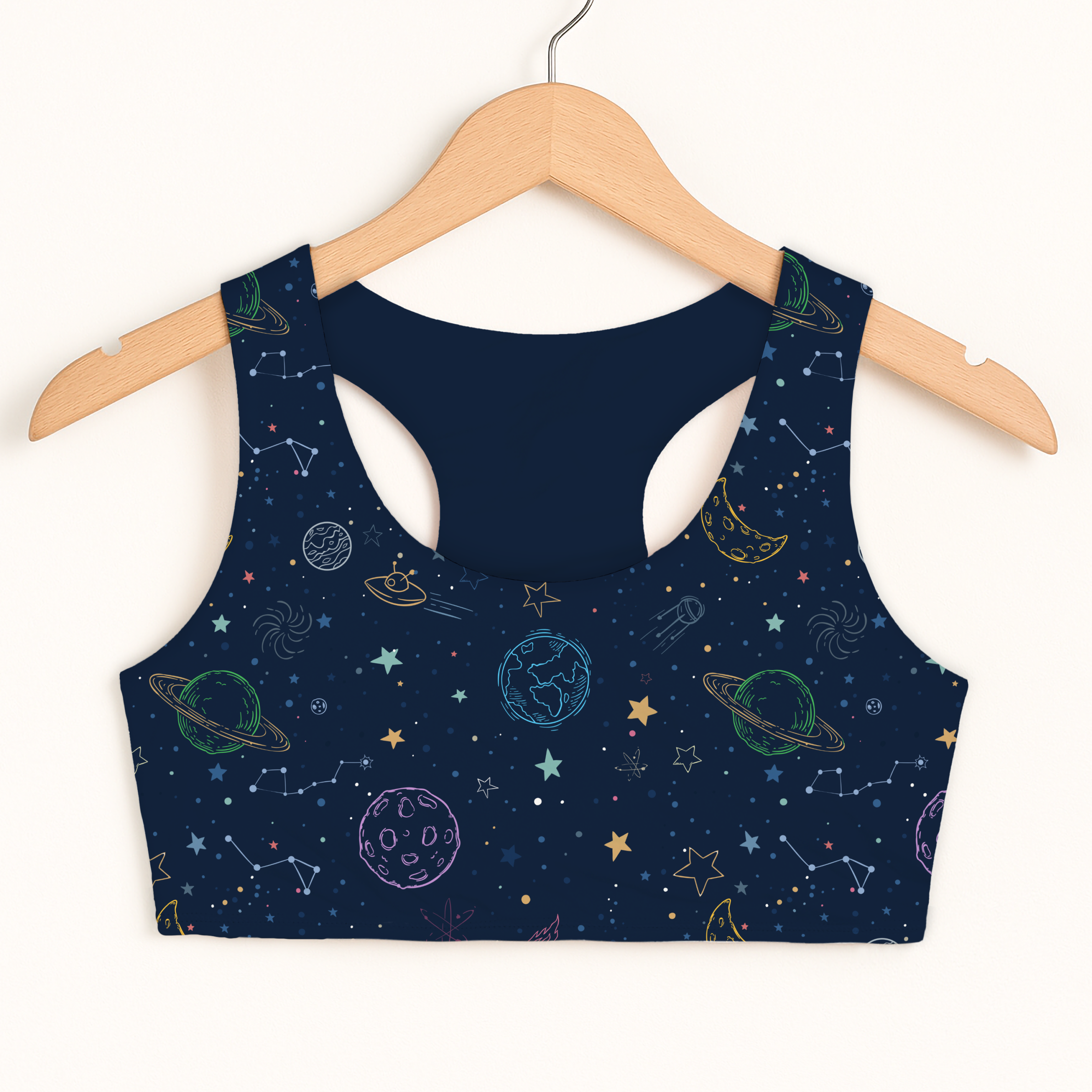 Girls colorful galaxy space sports bra in navy blue with quick drying fabric and double layered comfort features