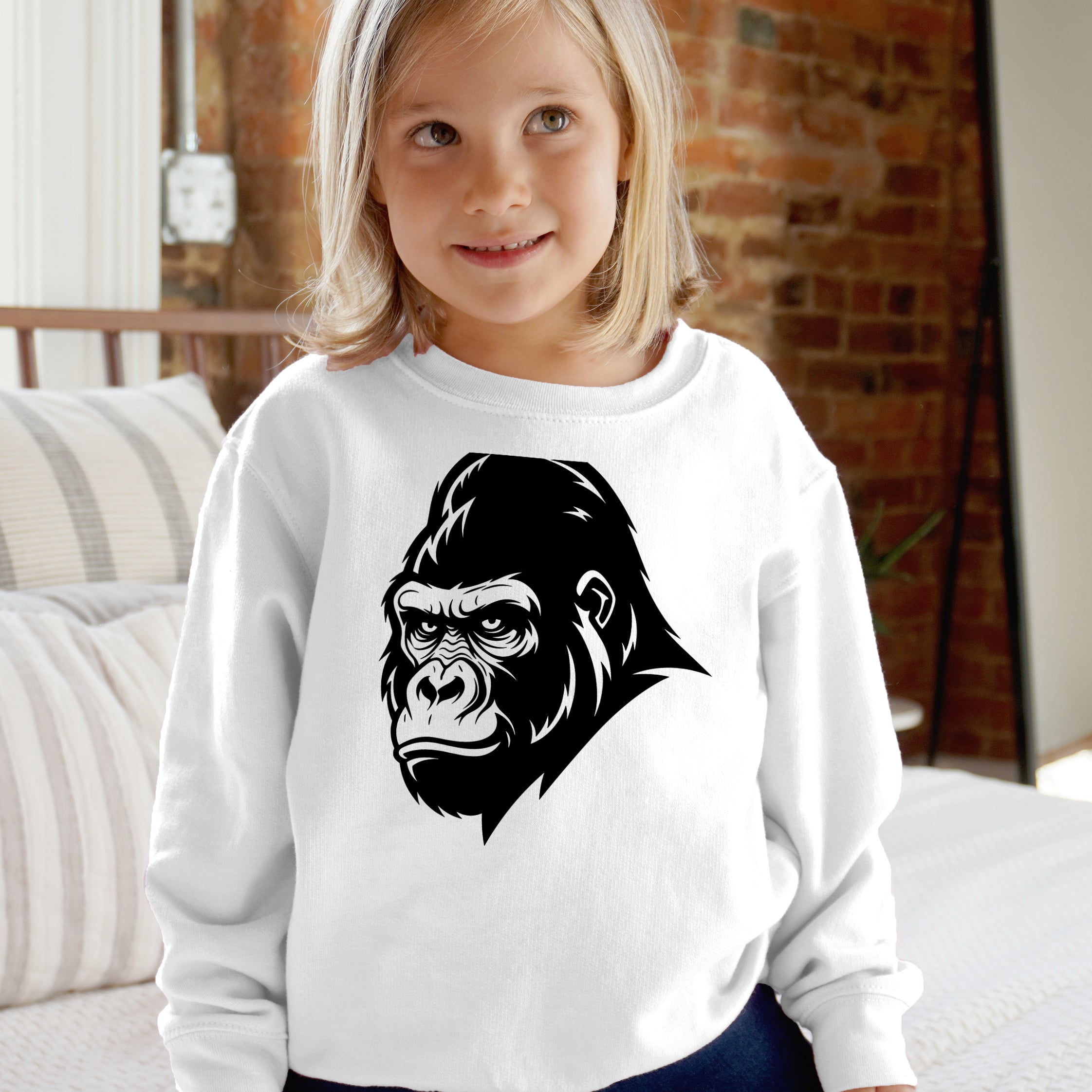 White kids long-sleeved sweatshirt with bold black gorilla head graphic on front perfect for casual wear