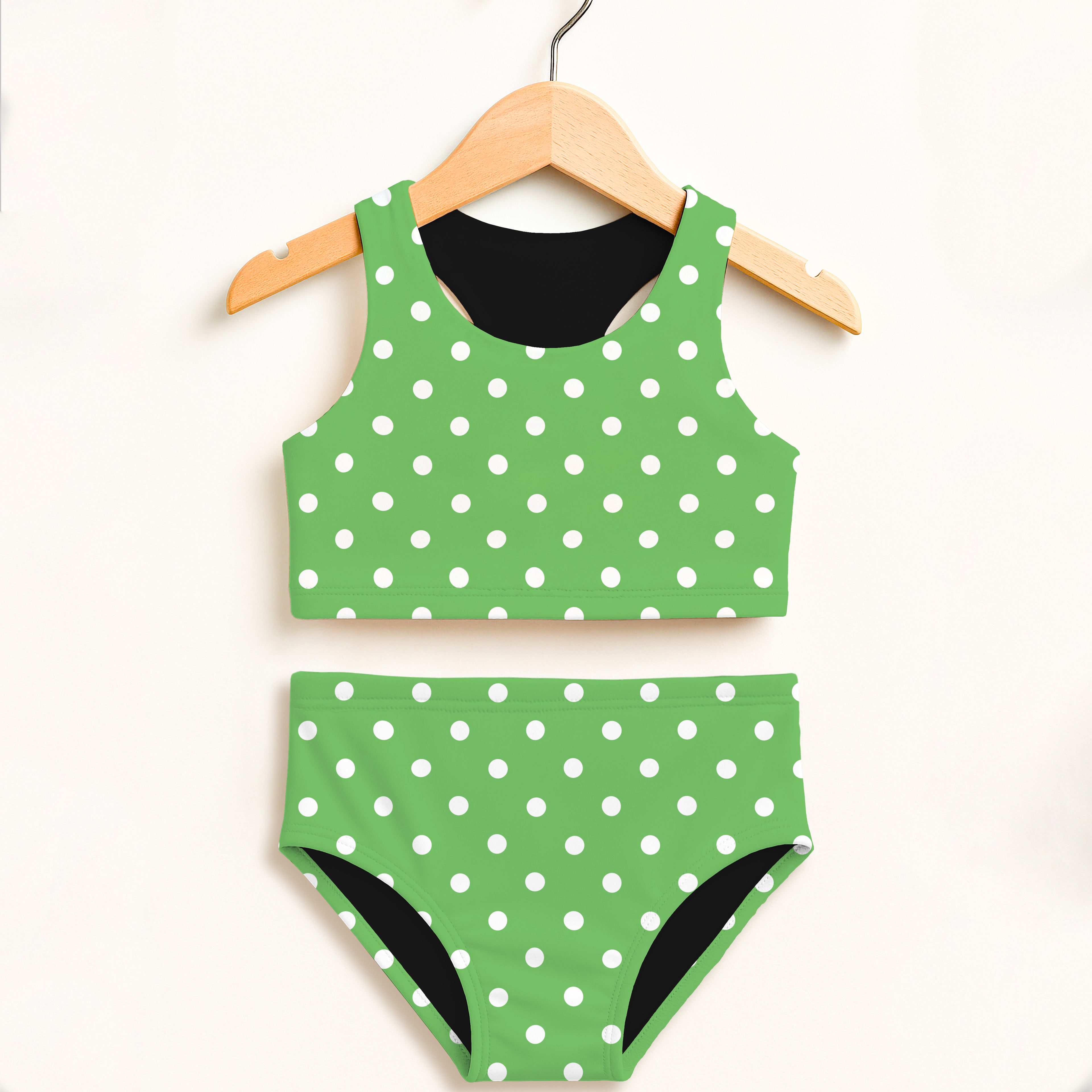 Girls green and white polka dot two piece swimsuit with black lining double layered upf 50+ high waisted comfort