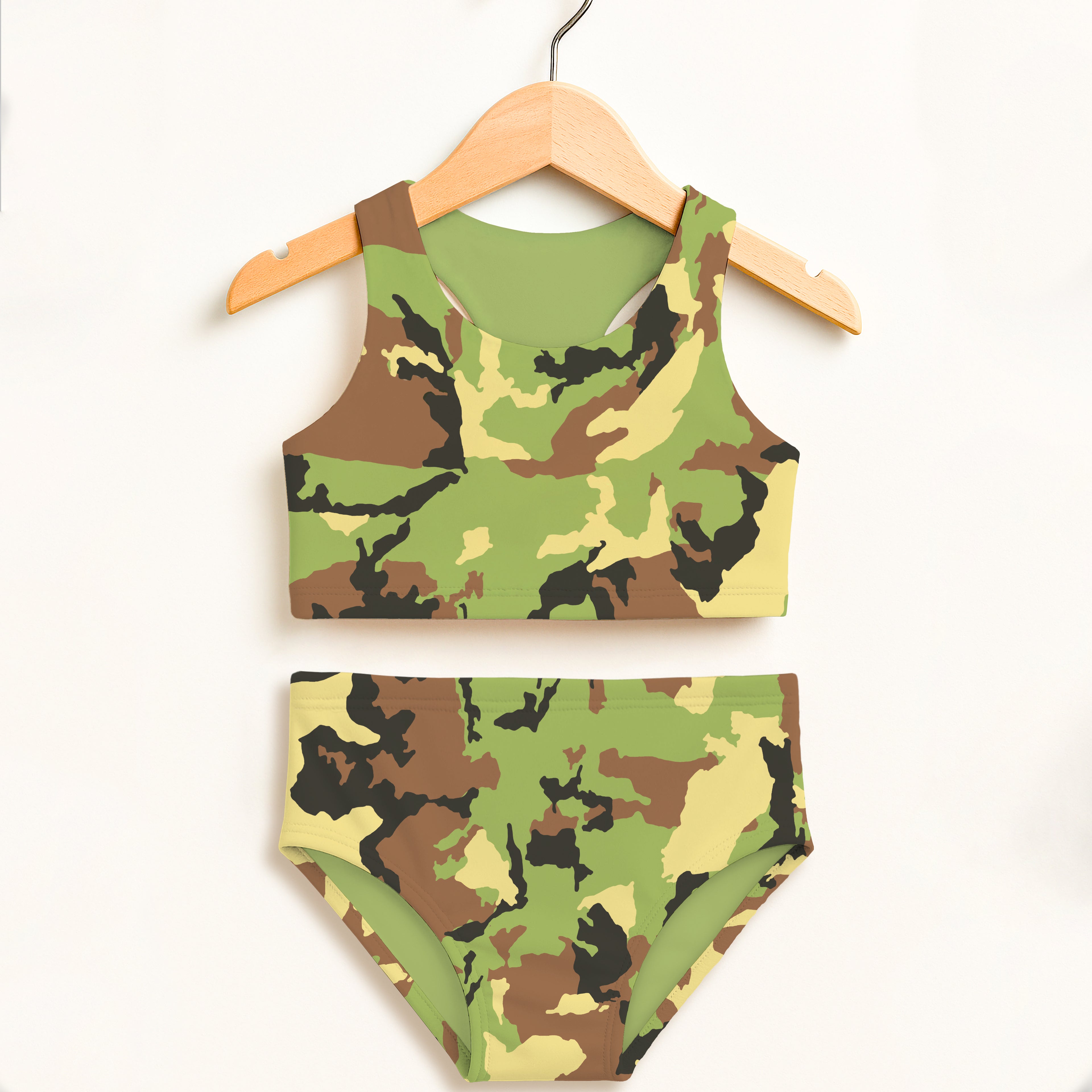 Girls green brown and black camouflage two-piece swimsuit hanging on wooden hanger double layered upf 50 high waisted