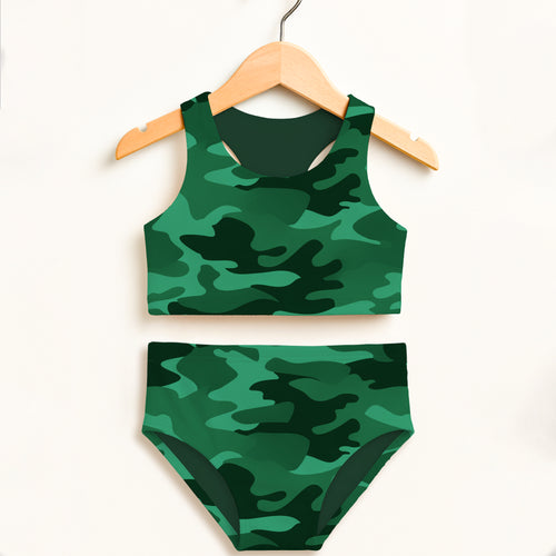 Girls dark green camouflage two-piece swimsuit with double layered upf 50+ fabric hanging on wooden hanger