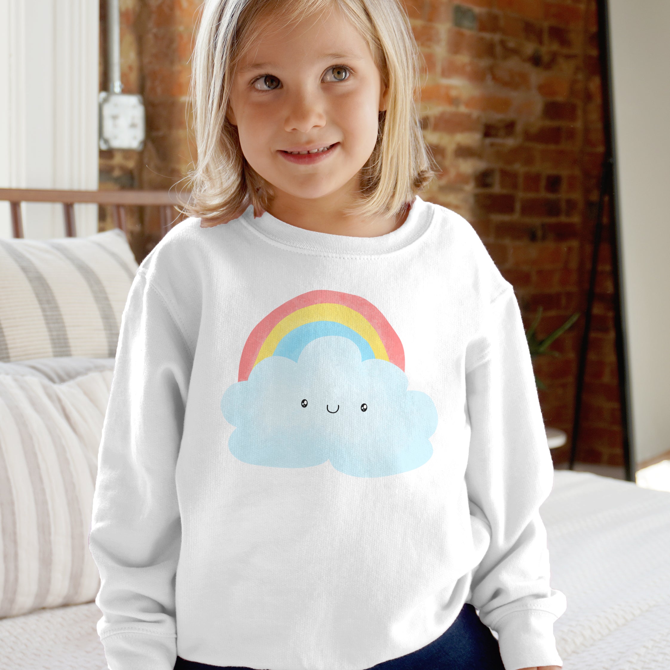 White long-sleeved kids sweatshirt with colorful rainbow and smiling light blue cloud design for toddlers and youth