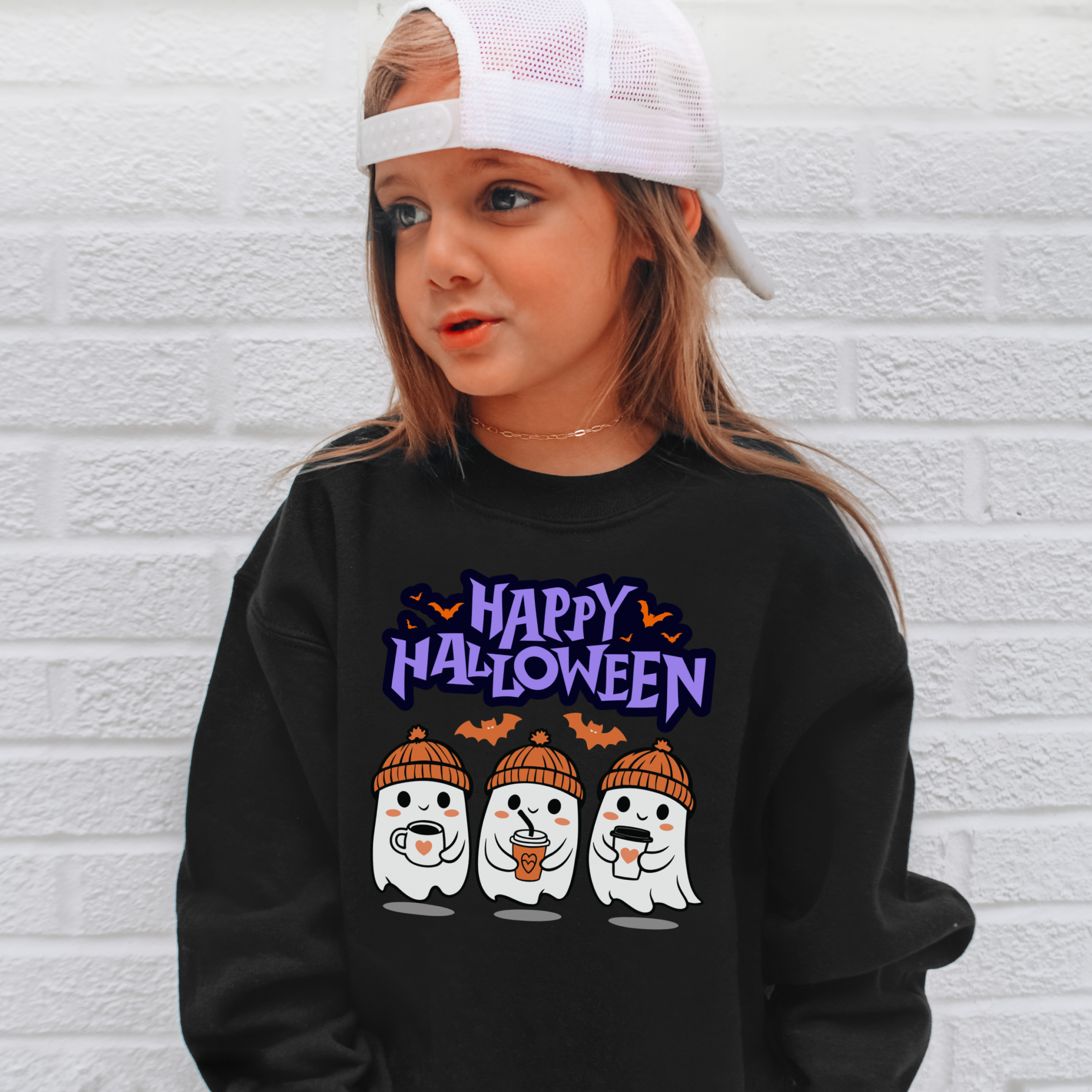 Black long-sleeved kids halloween sweatshirt with playful ghosts in orange hats holding drinks and happy halloween text