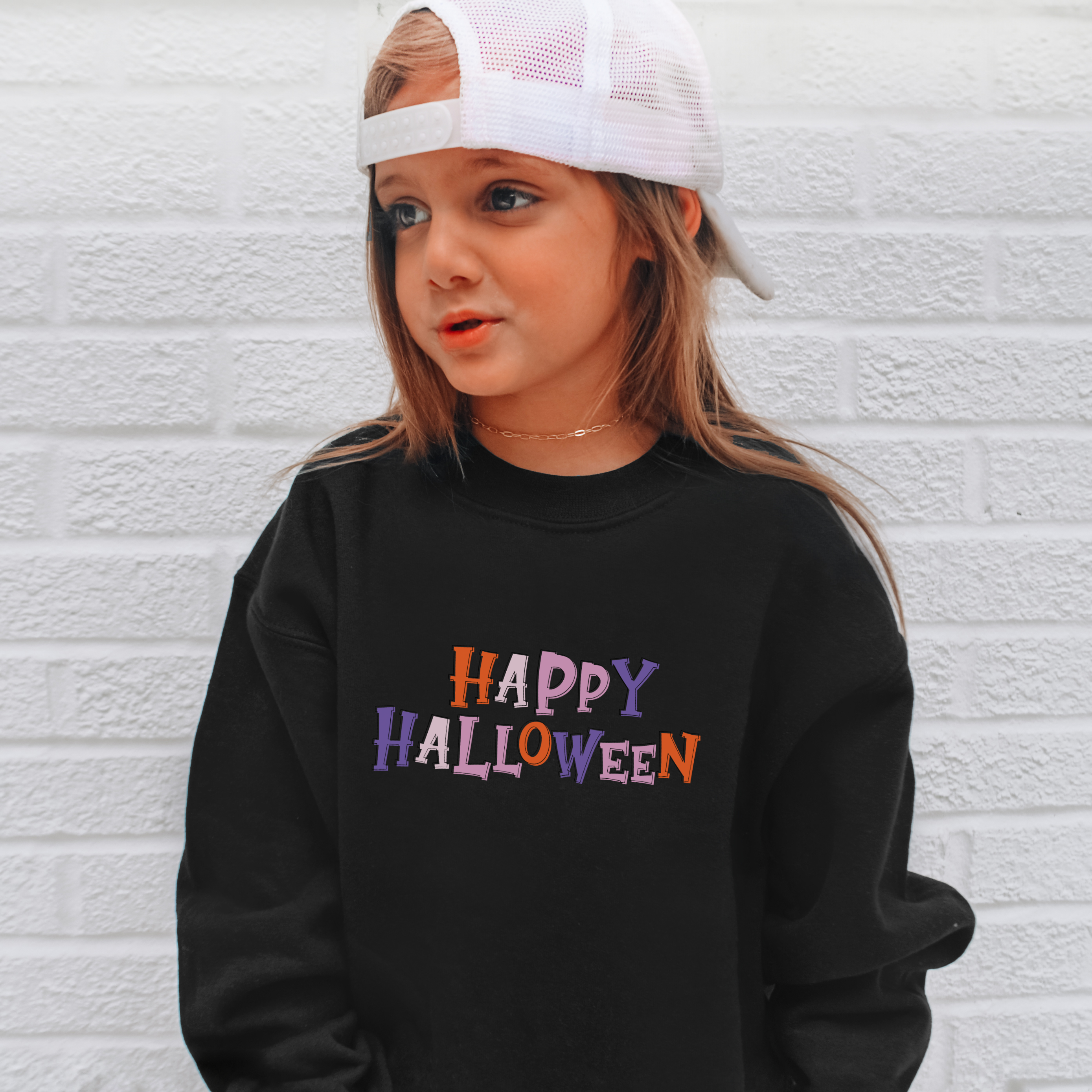 Black long-sleeved kids halloween sweatshirt with colorful happy halloween lettering in orange purple and pink