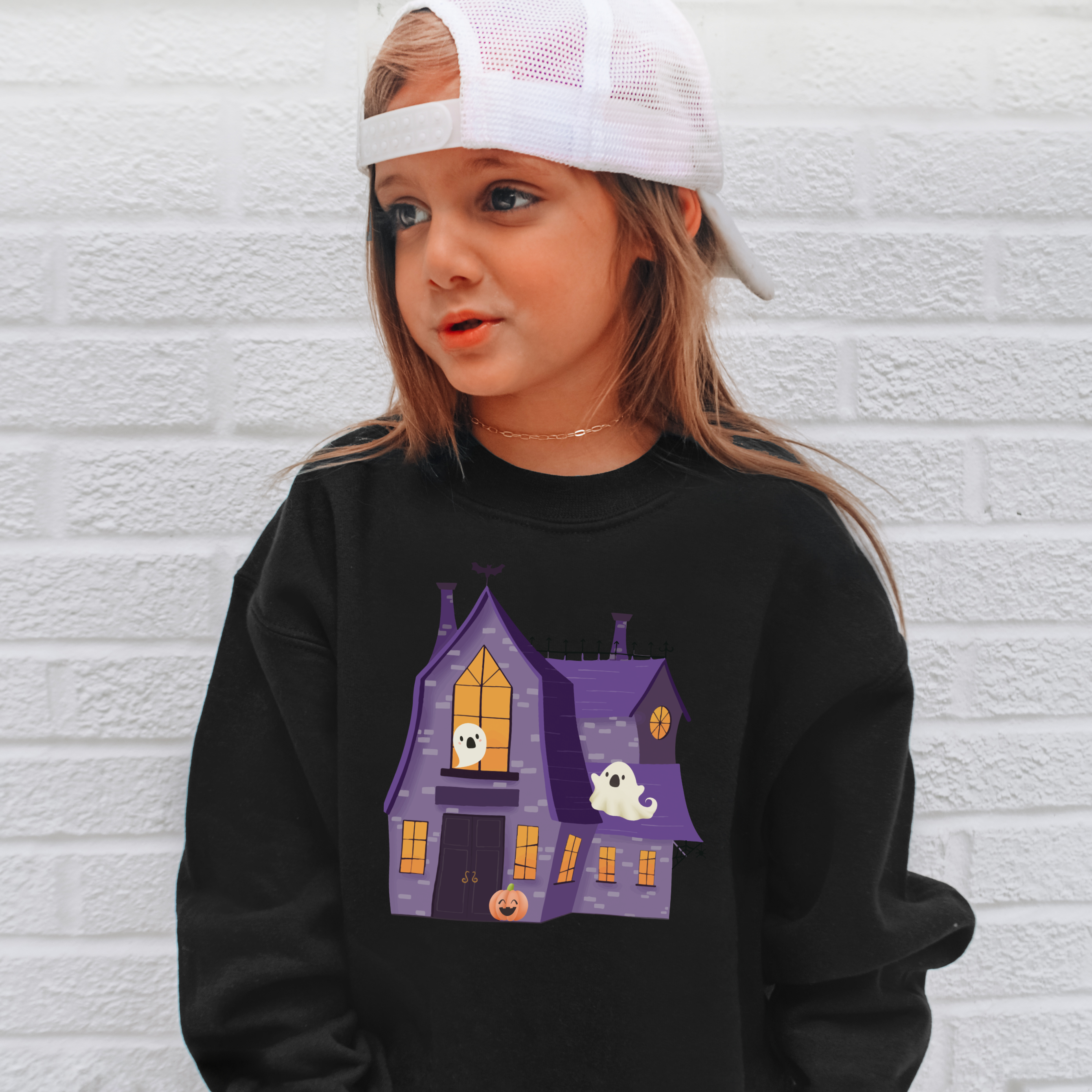 Black kids halloween sweatshirt with purple haunted house, glowing orange windows, and white ghosts for toddlers and youth