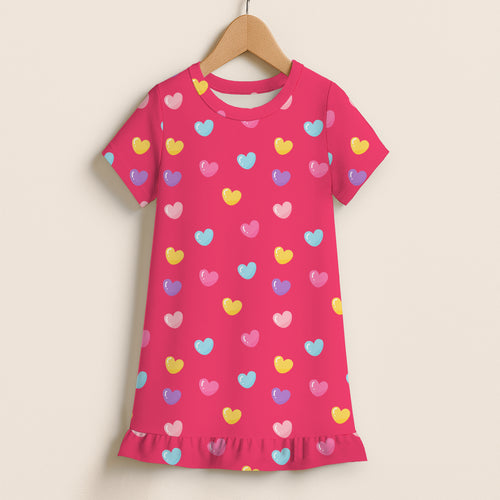 A vibrant pink girls short sleeve nightgown with colorful heart print and ruffle hem perfect for sleepwear