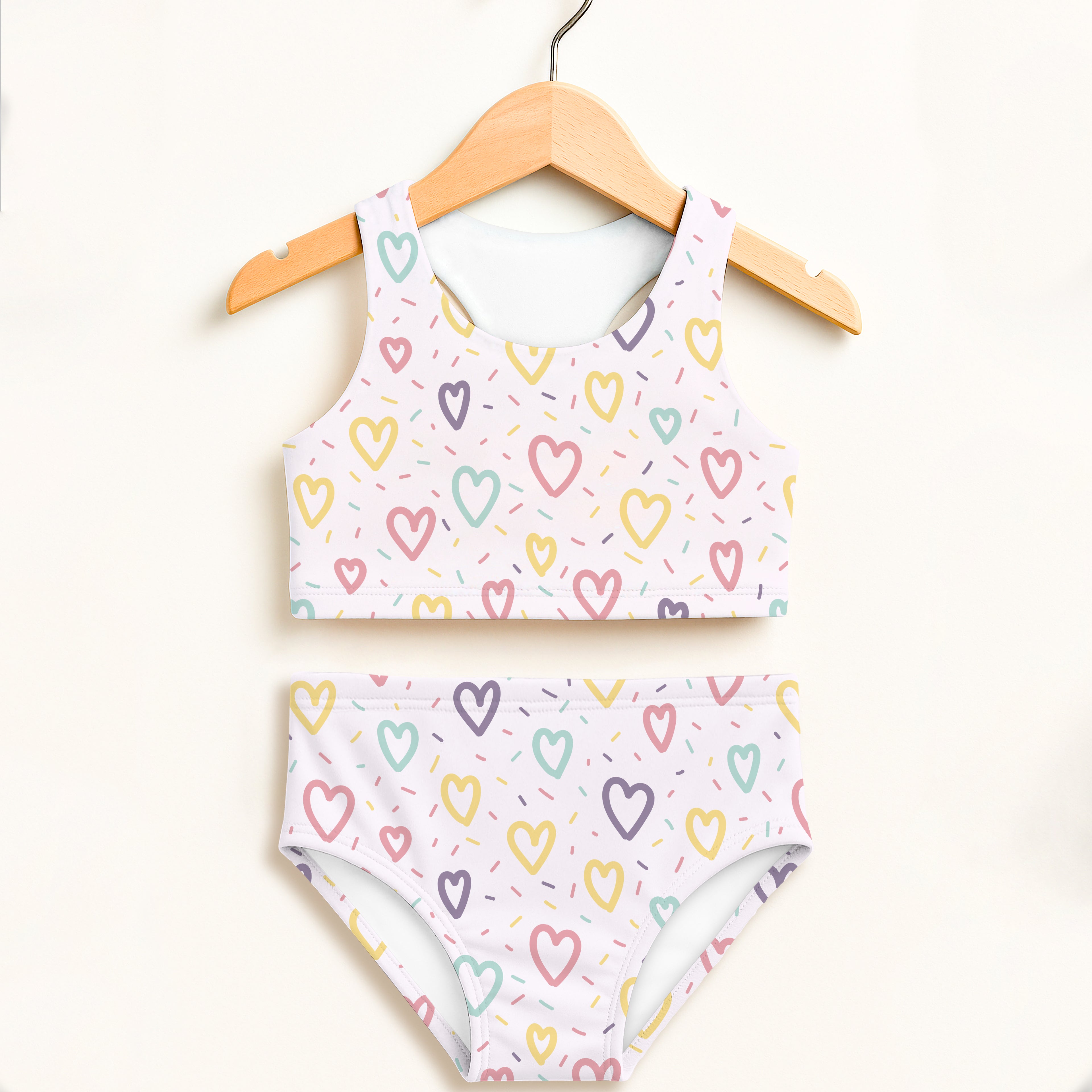 White girls two-piece swimsuit with pastel hearts and sprinkles pattern double layered UPF 50+ high waisted comfort