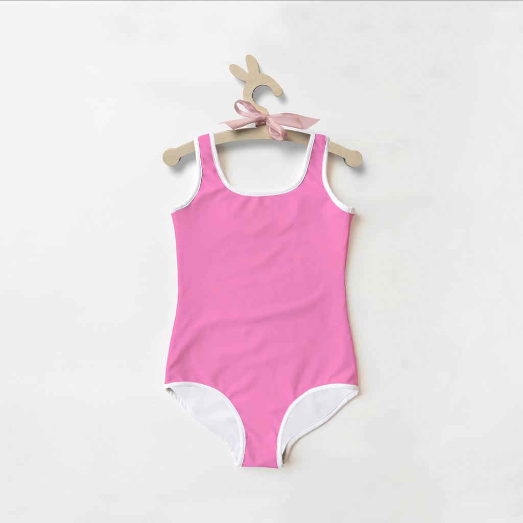 Girls buttery soft pink one-piece swimsuit with white trim and UPF 50 plus for sun protection