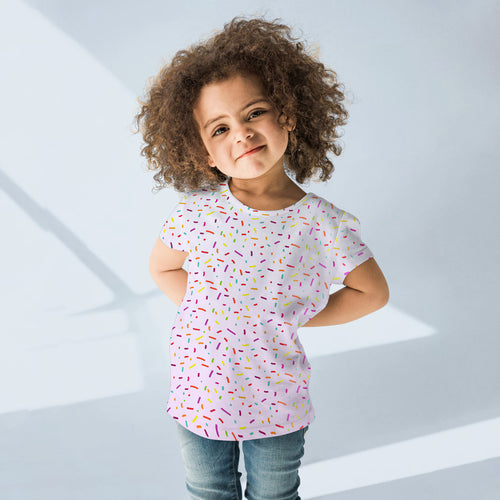 Girls colorful sprinkles short-sleeved t-shirt in soft pink with a playful multicolored sprinkle pattern for kids