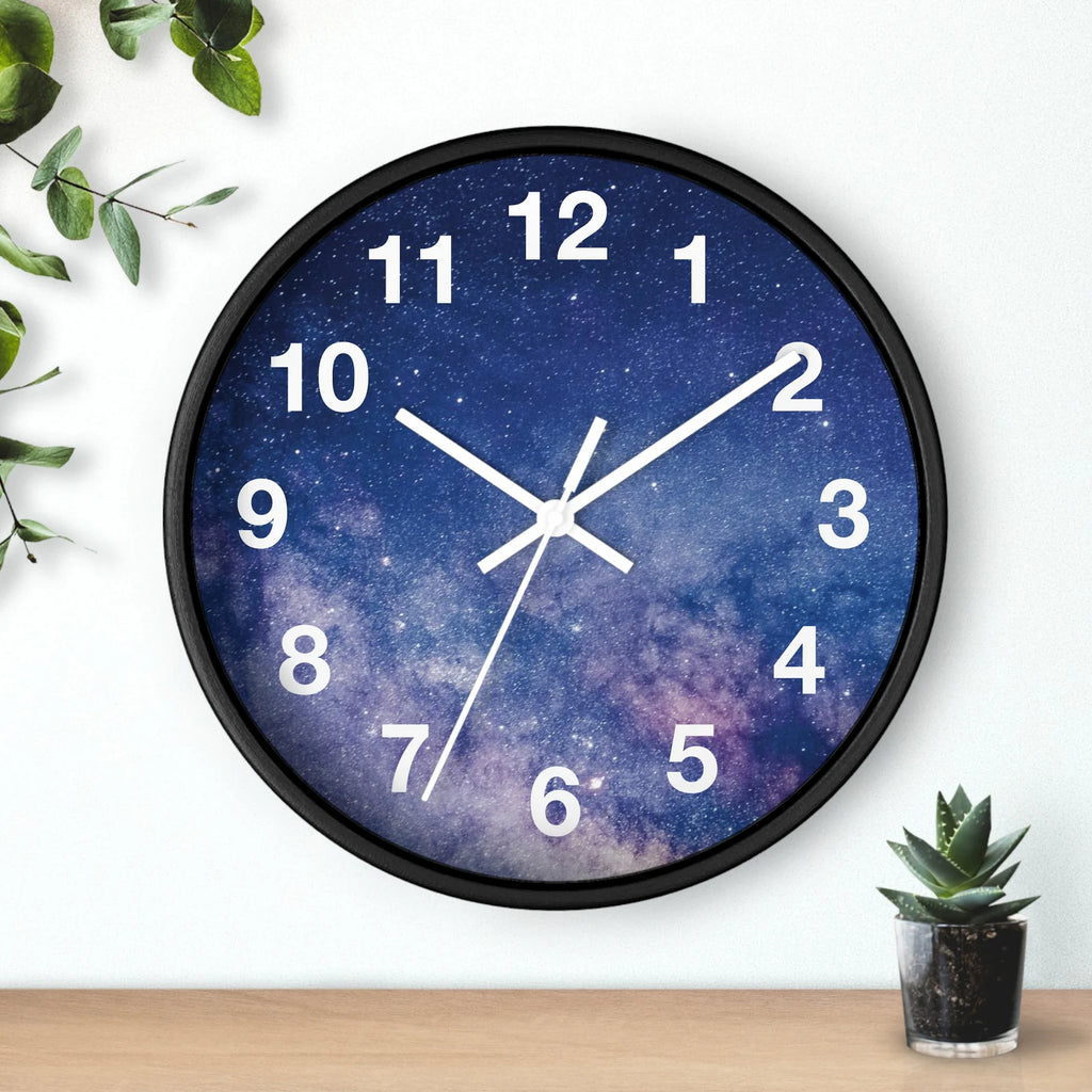 A round galaxy silent wood wall clock with black frame and cosmic deep blue purple star design