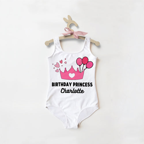 White girls birthday princess custom name swimsuit with pink crown and balloon graphic and black text personalization