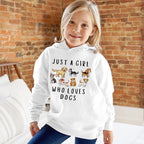 A girl wearing a white hoodie with the text 'JUST A GIRL WHO LOVES DOGS' and various cartoon dogs illustration