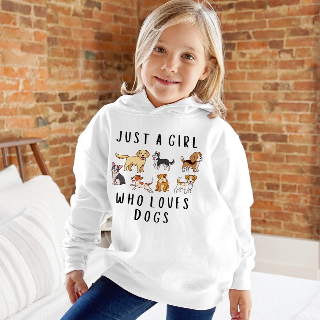 A girl wearing a white hoodie with the text 'JUST A GIRL WHO LOVES DOGS' and various cartoon dogs illustration