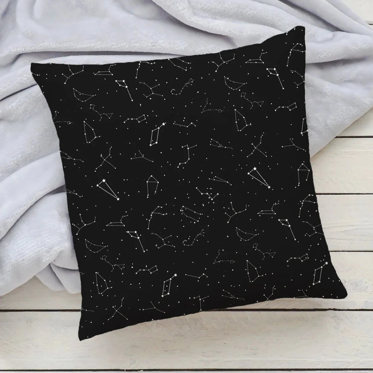 Black realistic constellations pillow featuring a white constellation pattern on a soft cushion cover