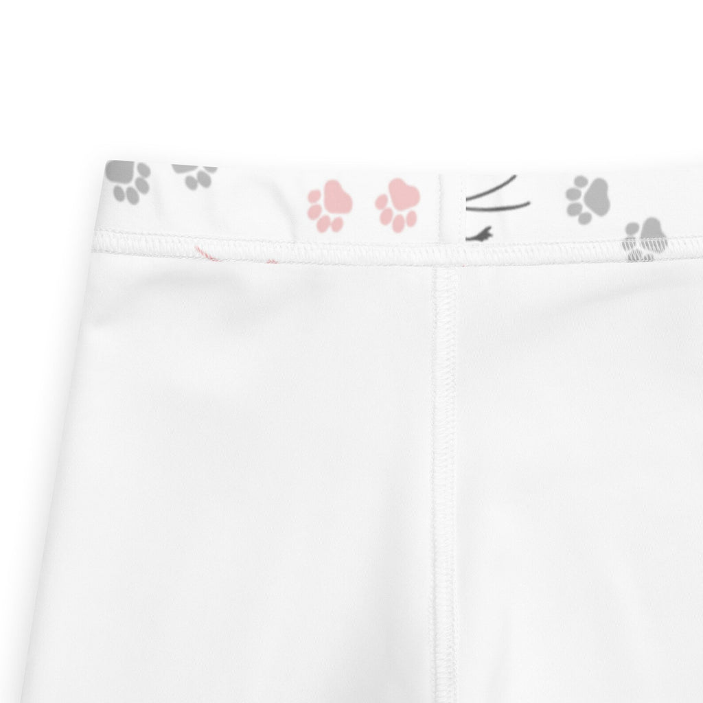White girls leggings with playful pink and gray paw print waistband and cat whiskers detail on front