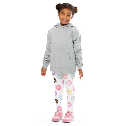 A child wearing girls colorful donuts leggings in white with multicolor donut print paired with a light gray hoodie