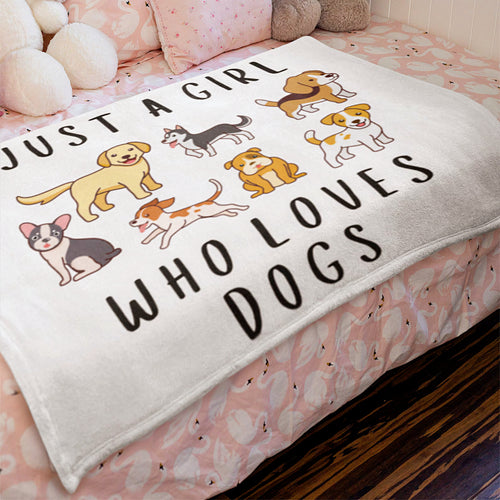 White plush girls blanket with cartoon dogs and just a girl who loves dogs text in black lettering