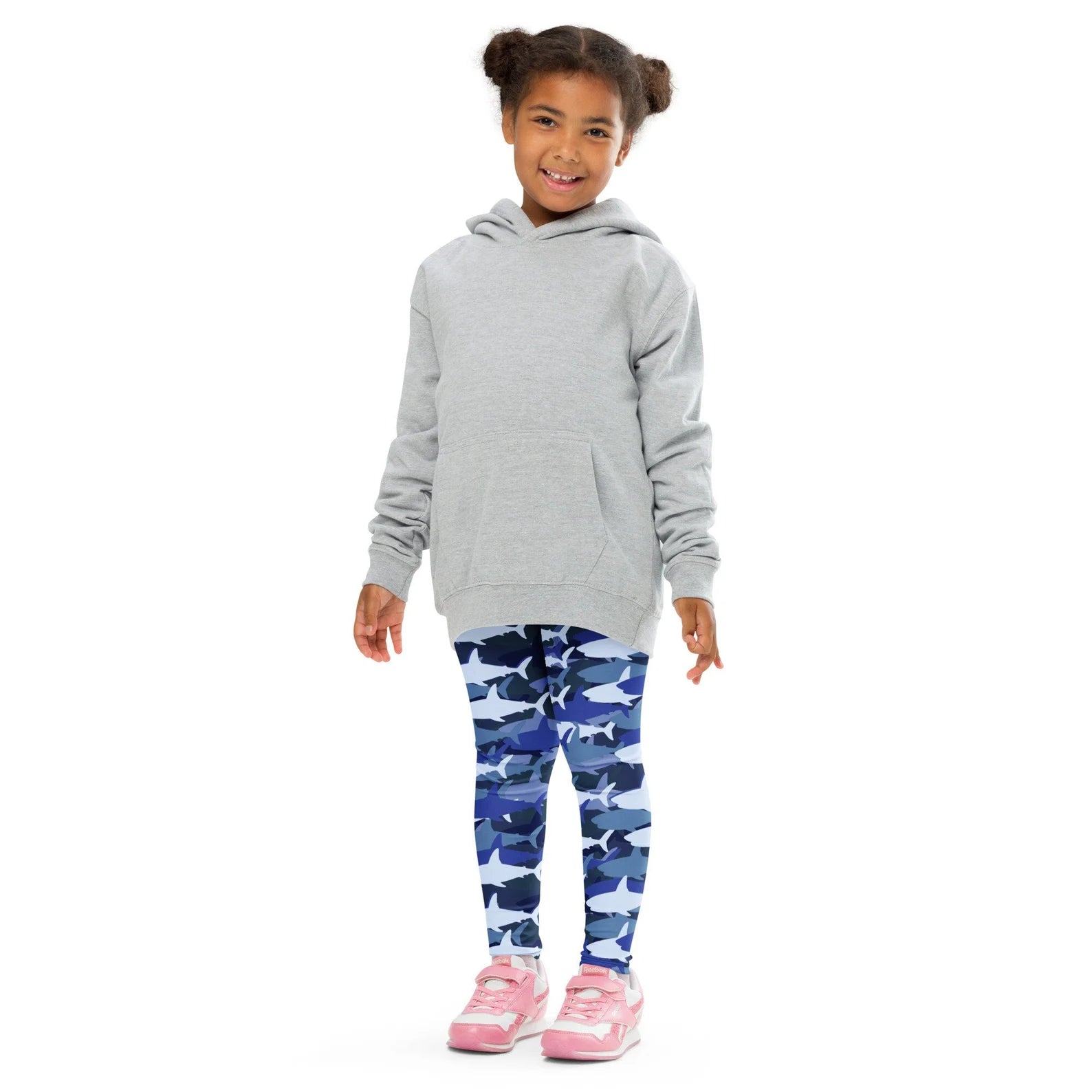 Gray hooded sweatshirt with front pocket and long sleeves paired with kids blue shark buttery soft leggings
