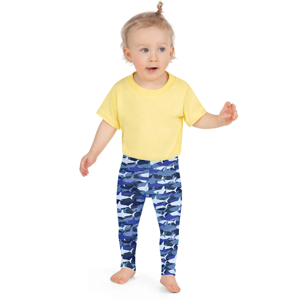 Kids blue shark buttery soft leggings featuring blue and white shark patterns made from soft fabric for comfort