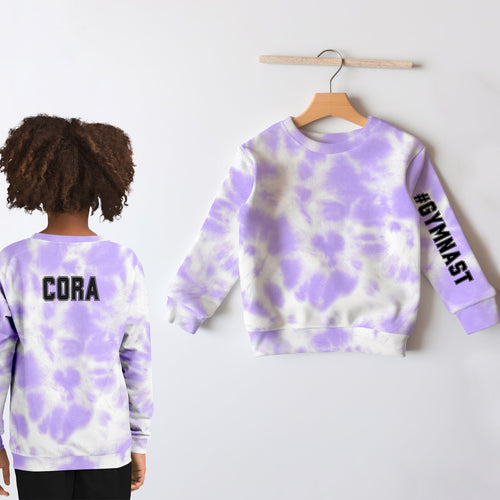 Back of girls customizable faux purple and white tie dye sweatshirt in cozy cotton fleece with cora text and gymnast sleeve
