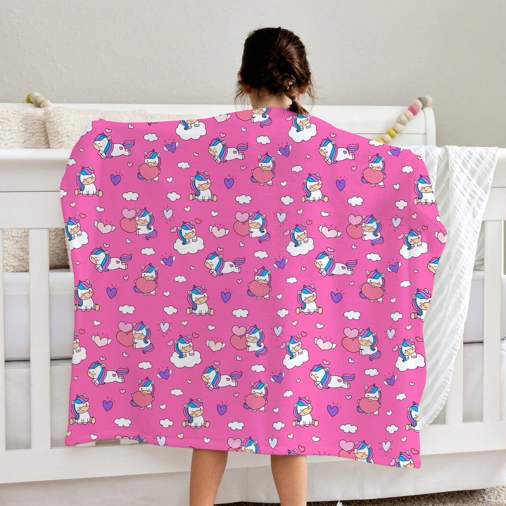 Pink girls unicorn hearts blanket with playful cartoon unicorns clouds and hearts pattern in white and purple