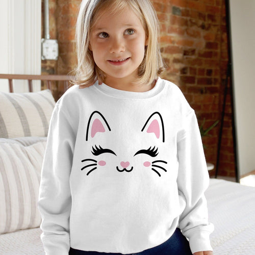 White long-sleeved girls sweatshirt with cute cartoon cat face pink ears black eyes whiskers and heart nose
