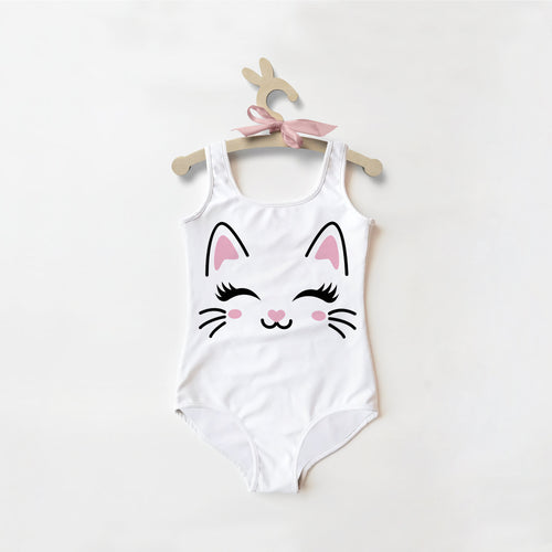 White one-piece swimsuit for girls with cute cartoon cat face, pink ears, black eyelashes, rosy cheeks, and upf 50+ protection