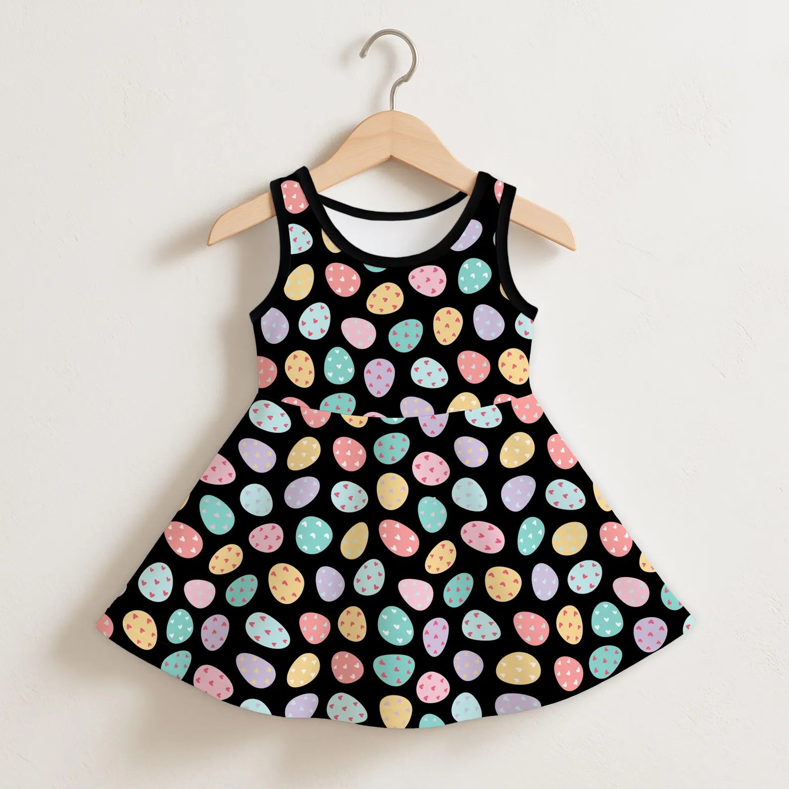 Girls colorful easter eggs black sleeveless dress with flared skirt and pastel pink blue yellow purple egg patterns