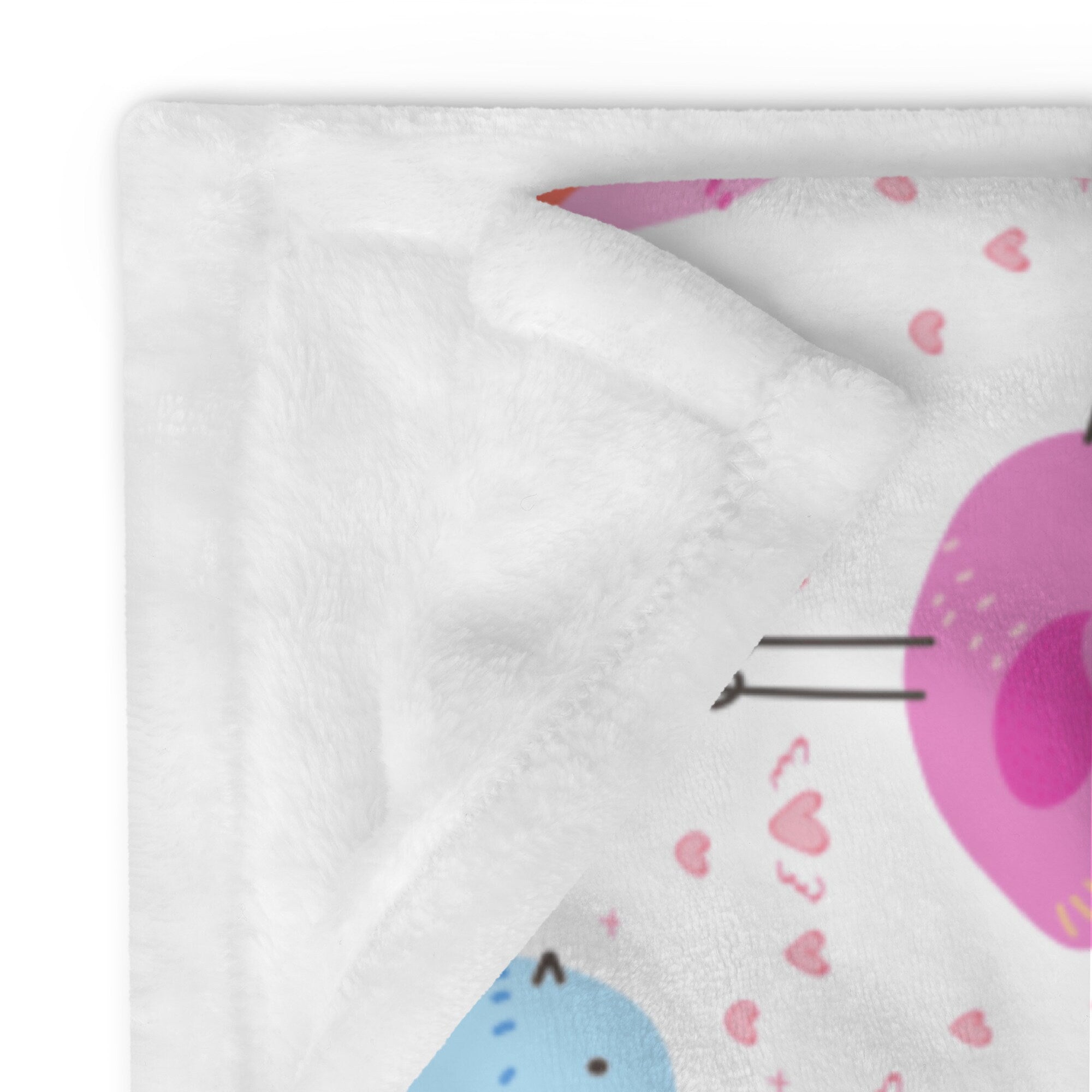 White plush girls colorful birds blanket with playful cartoon cat design featuring pink blue donut ears and hearts